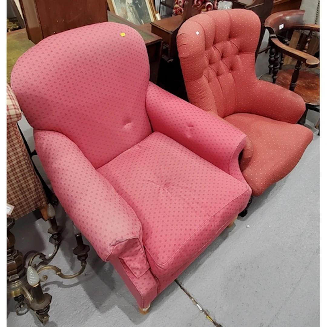 A pink upholstered Armchair and a red button back Armchair, ...
