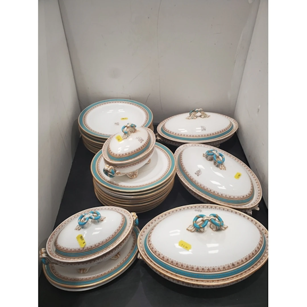 An antique turquoise and gilt Armorial Dinner Service includ...
