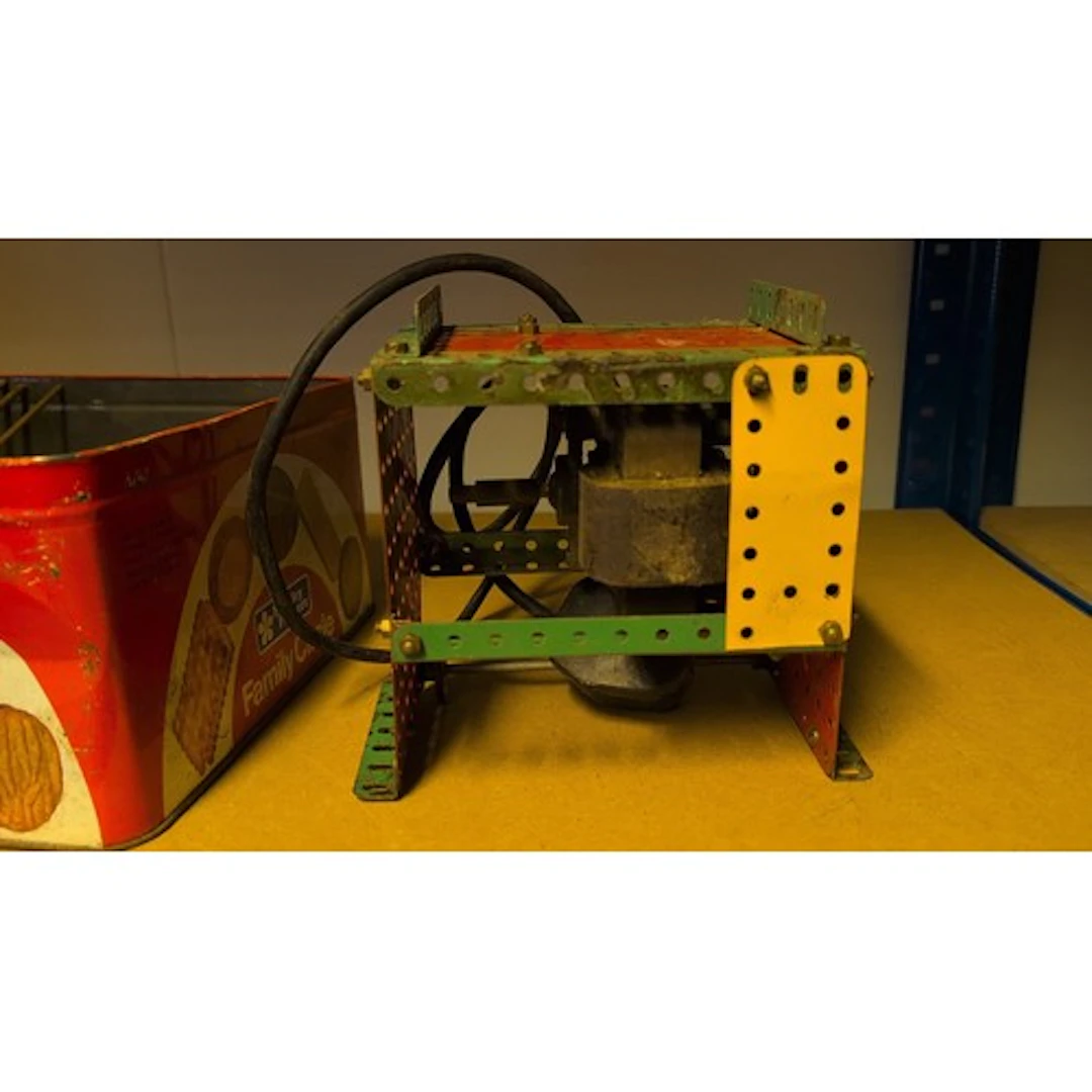 Meccano construction components, including an assembled moto...