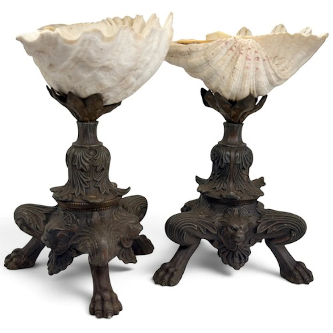 A pair of decorative cast metal tripod tazzas, the bowls for...