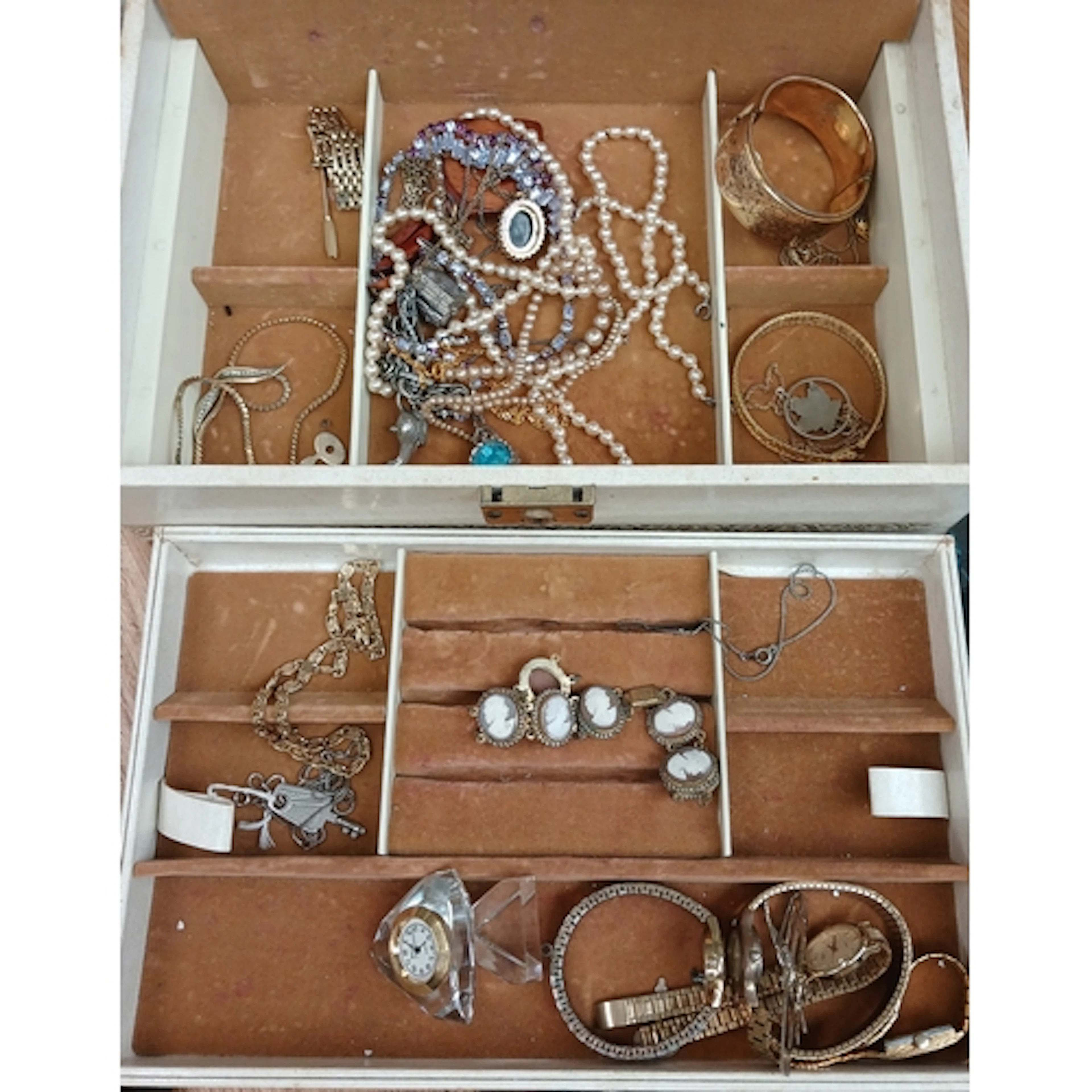 A jewellery box containing mainly gold plated costume jewell...