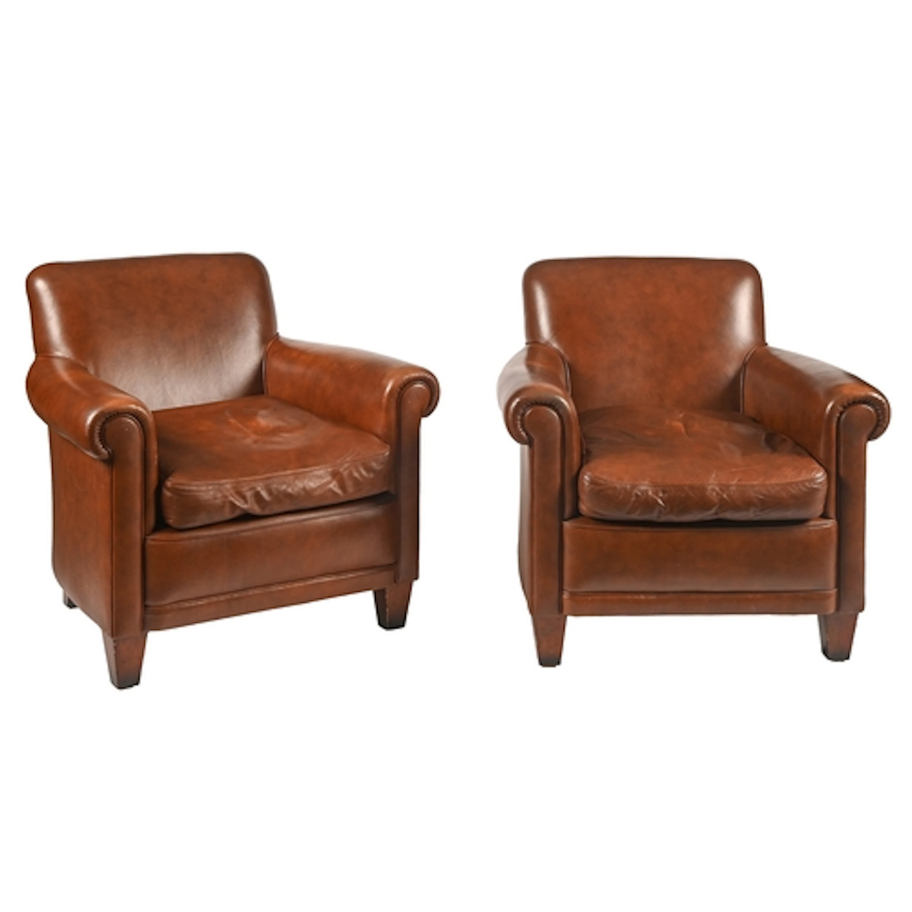 A pair of Laura Ashley tan leather armchairs, seat height 33...