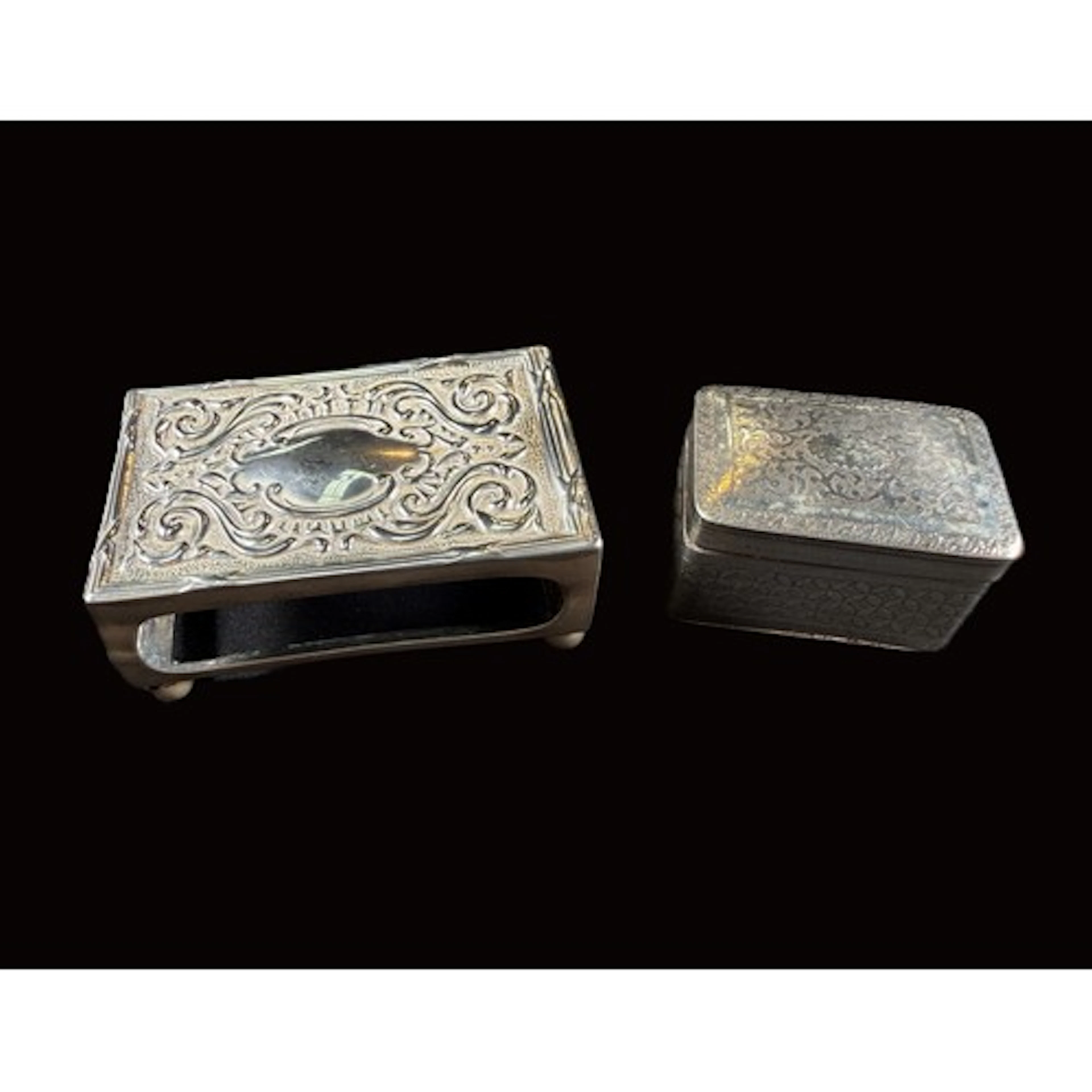 A chased hallmarked silver snuff box with original pierced e...
