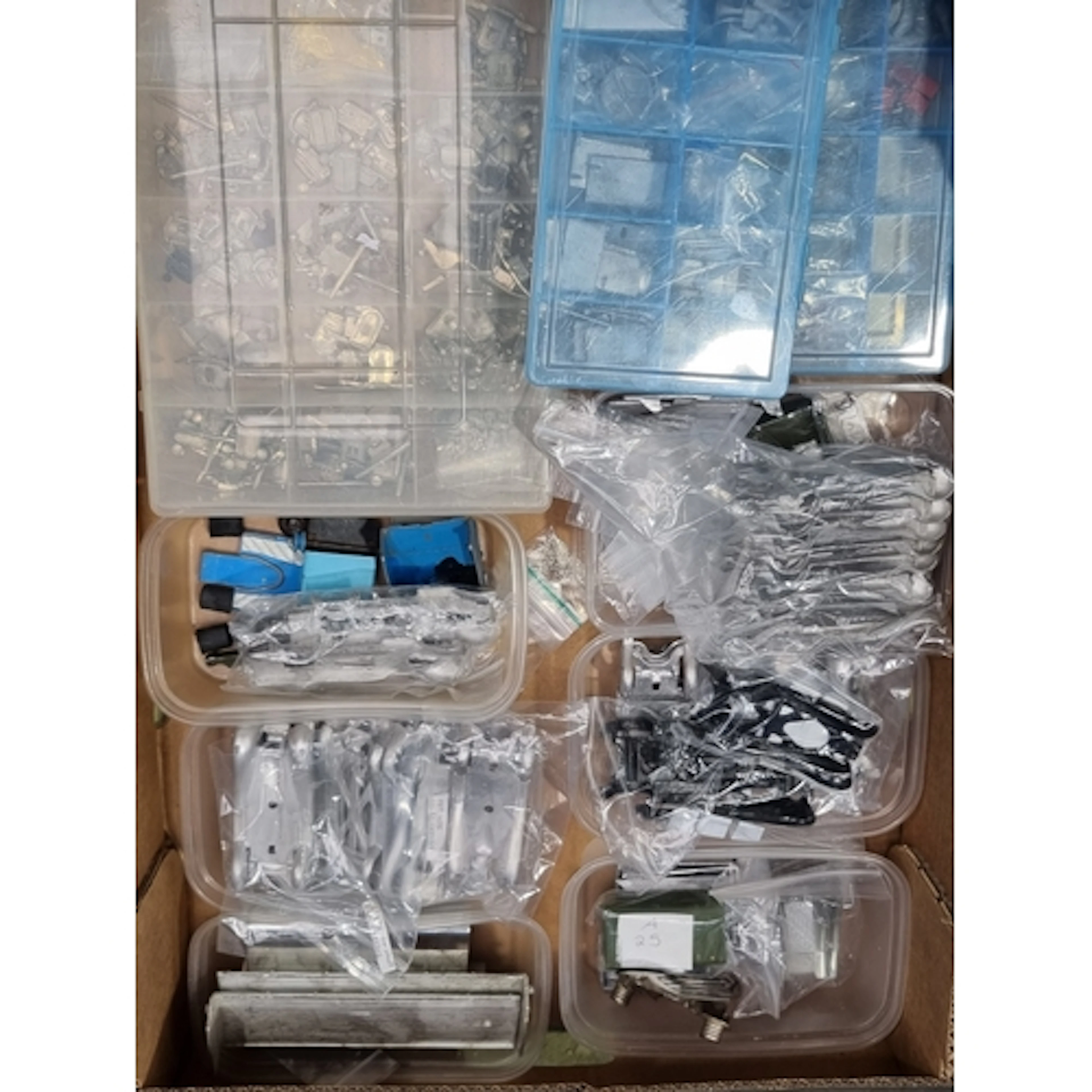 A box of Dinky Toys white metal replacement parts including ...