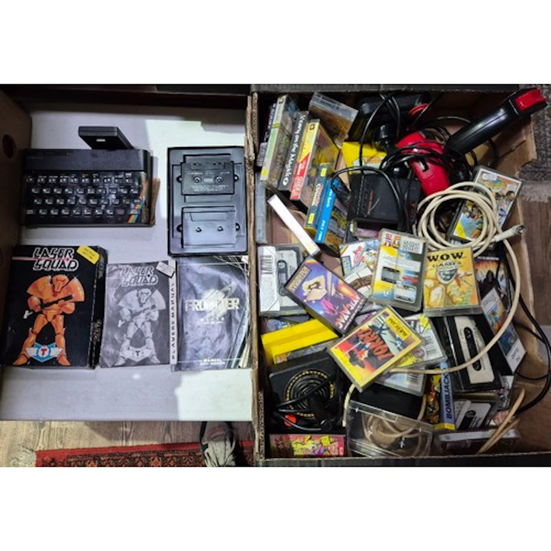 A Sinclair ZX Spectrum with accessories & various games.
