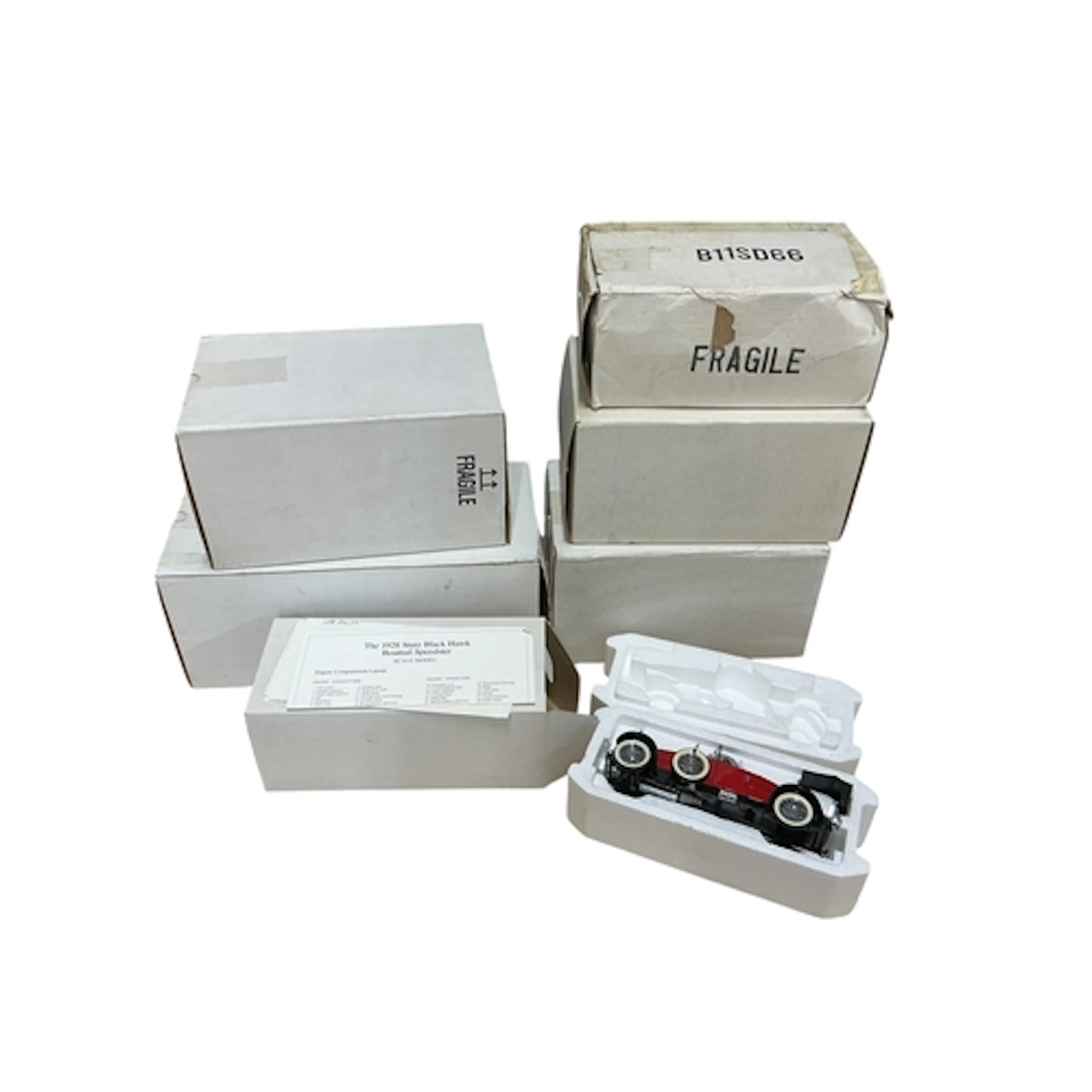Six boxed Franklin Mint model vehicles; a 1928 Stutz Black H...