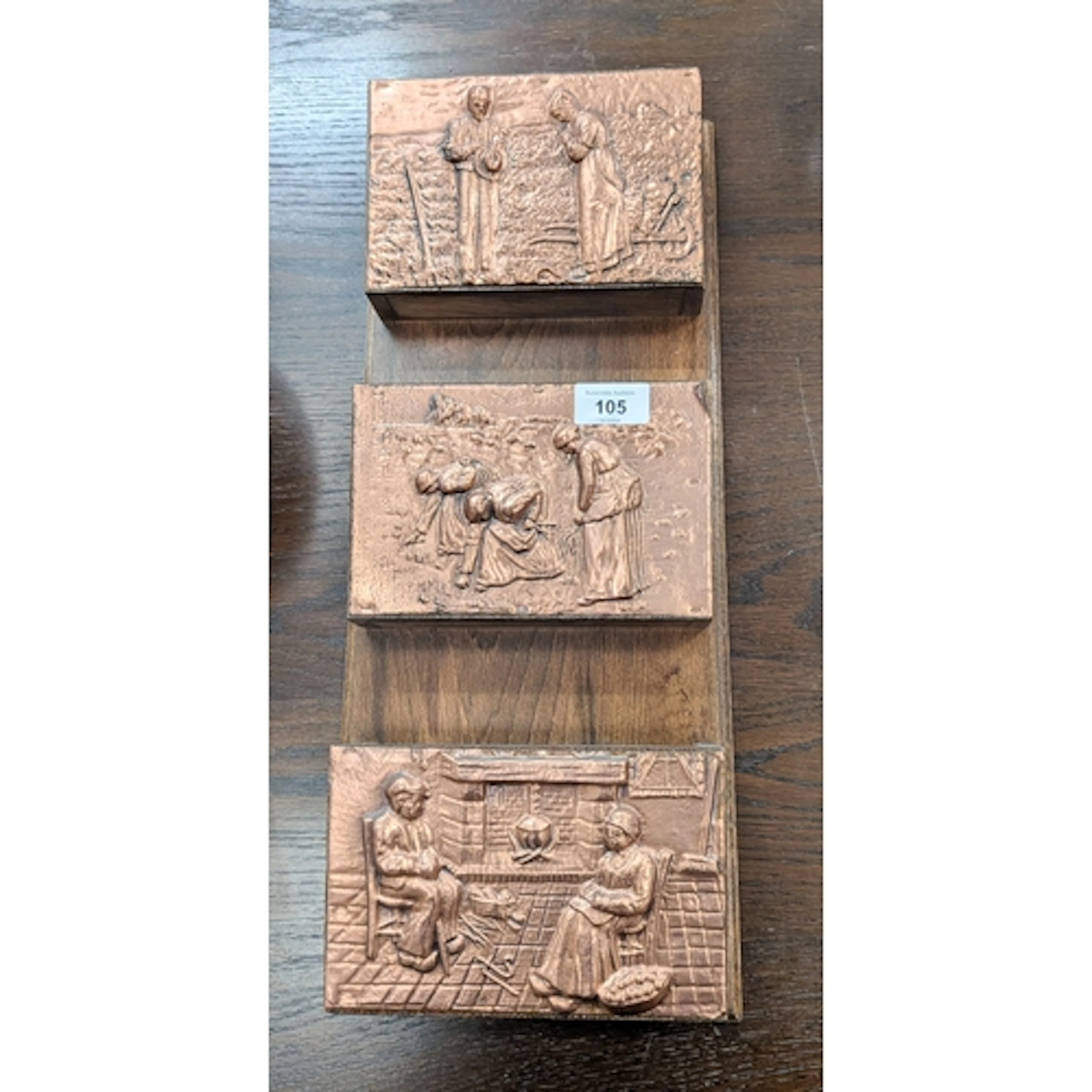 A three tier wall mounting copper embossed letter rack