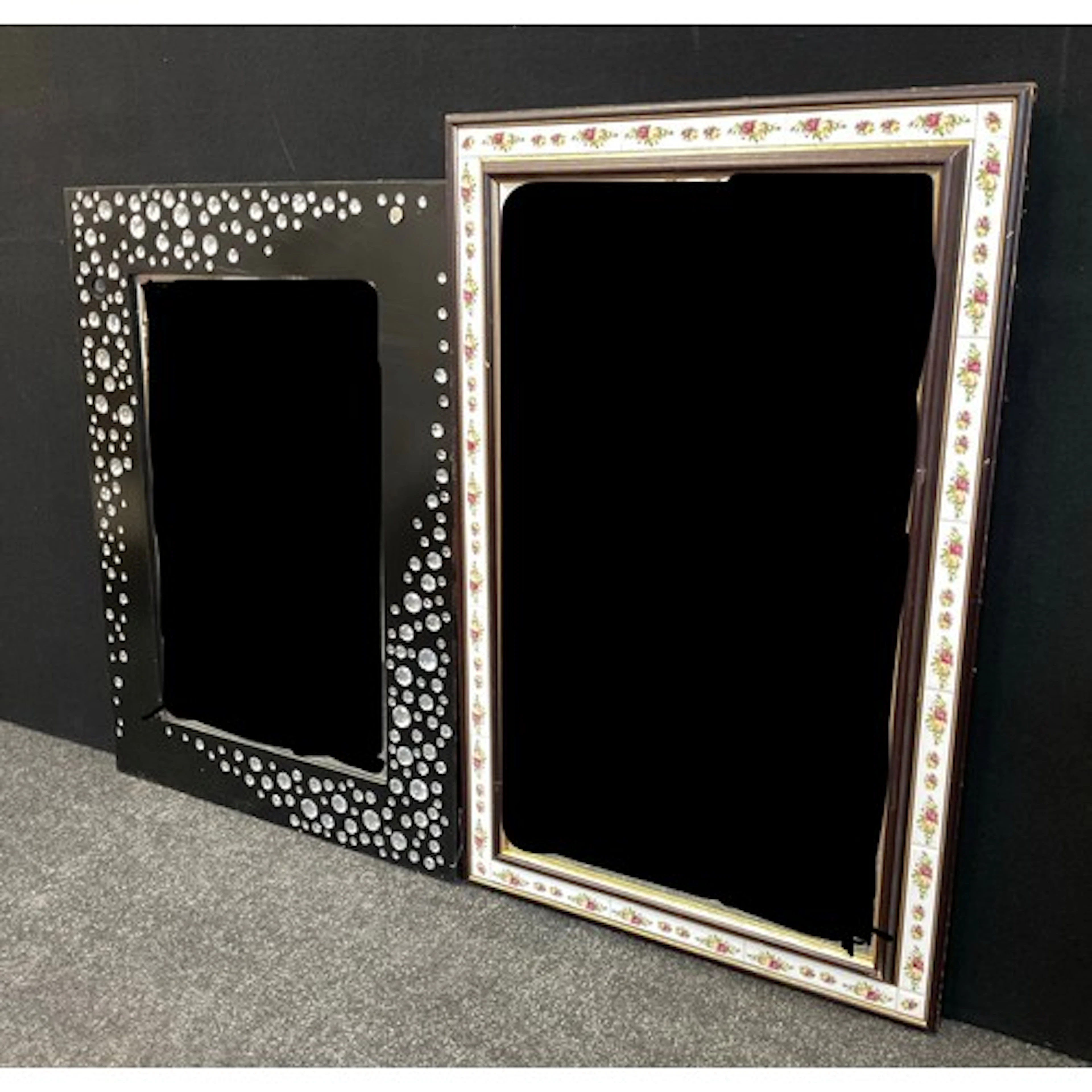 A rectangular crystal adorned black framed wall mirror, 78cm...