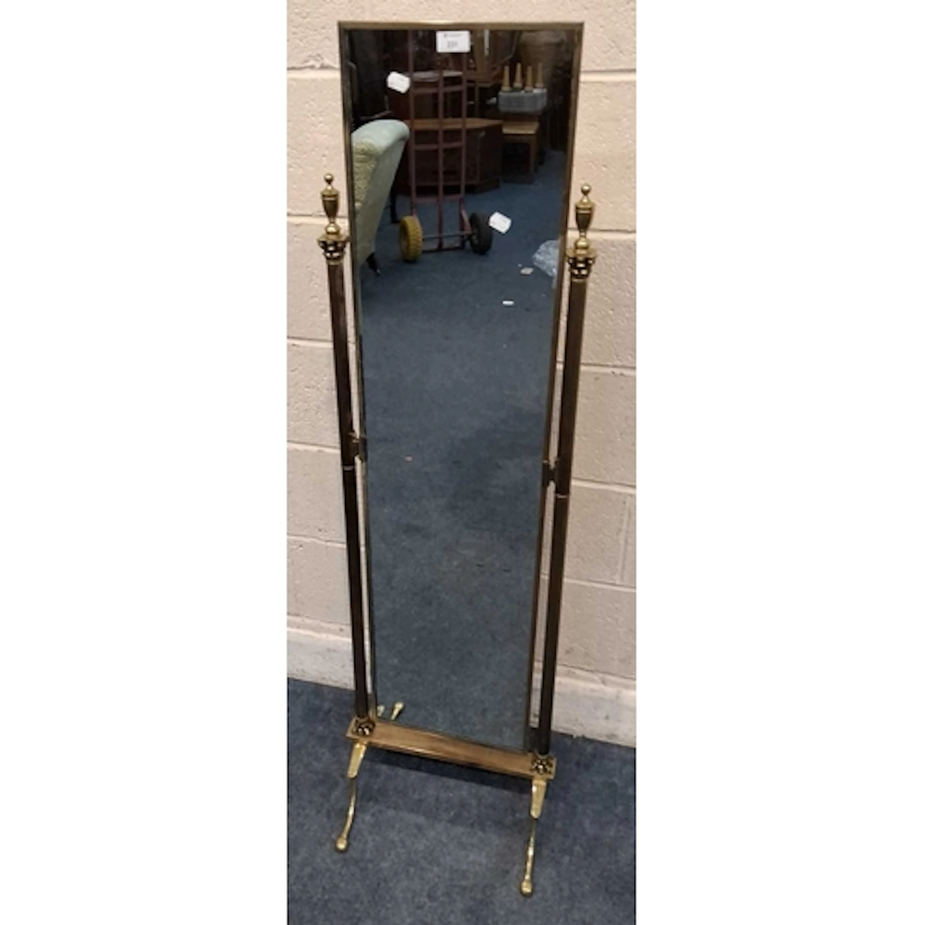 A PEERAGE BRASS CHEVAL MIRROR, with a rectangular plate, Cor...
