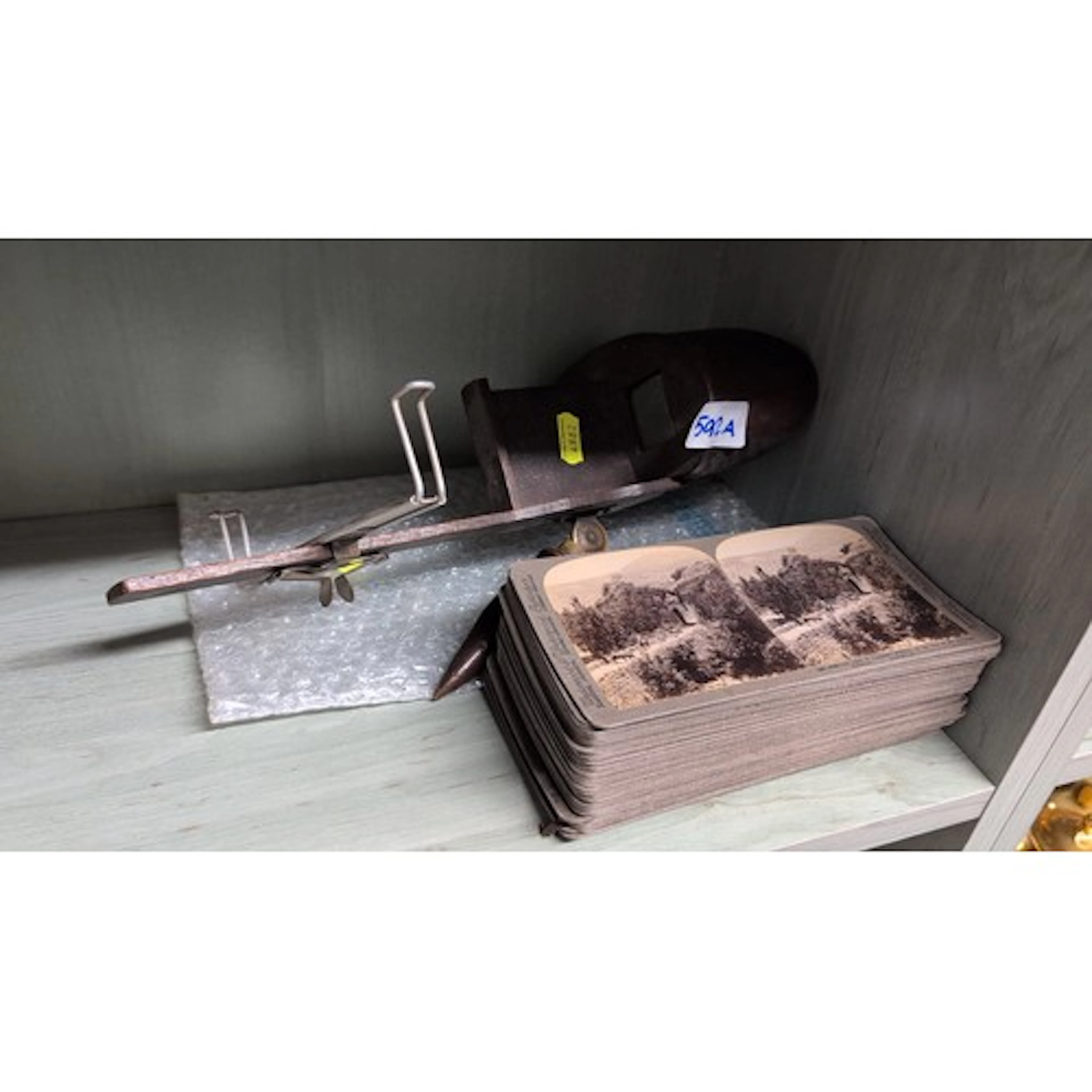 Early C20 stereoscope together with a quantity of stereoview...