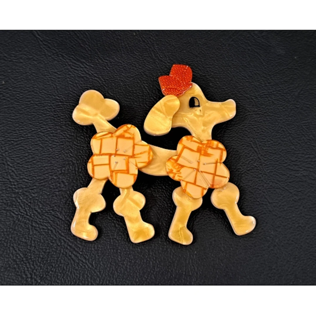 LEA STEIN POODLE DOG BROOCH the opalescent butterscotch colo...