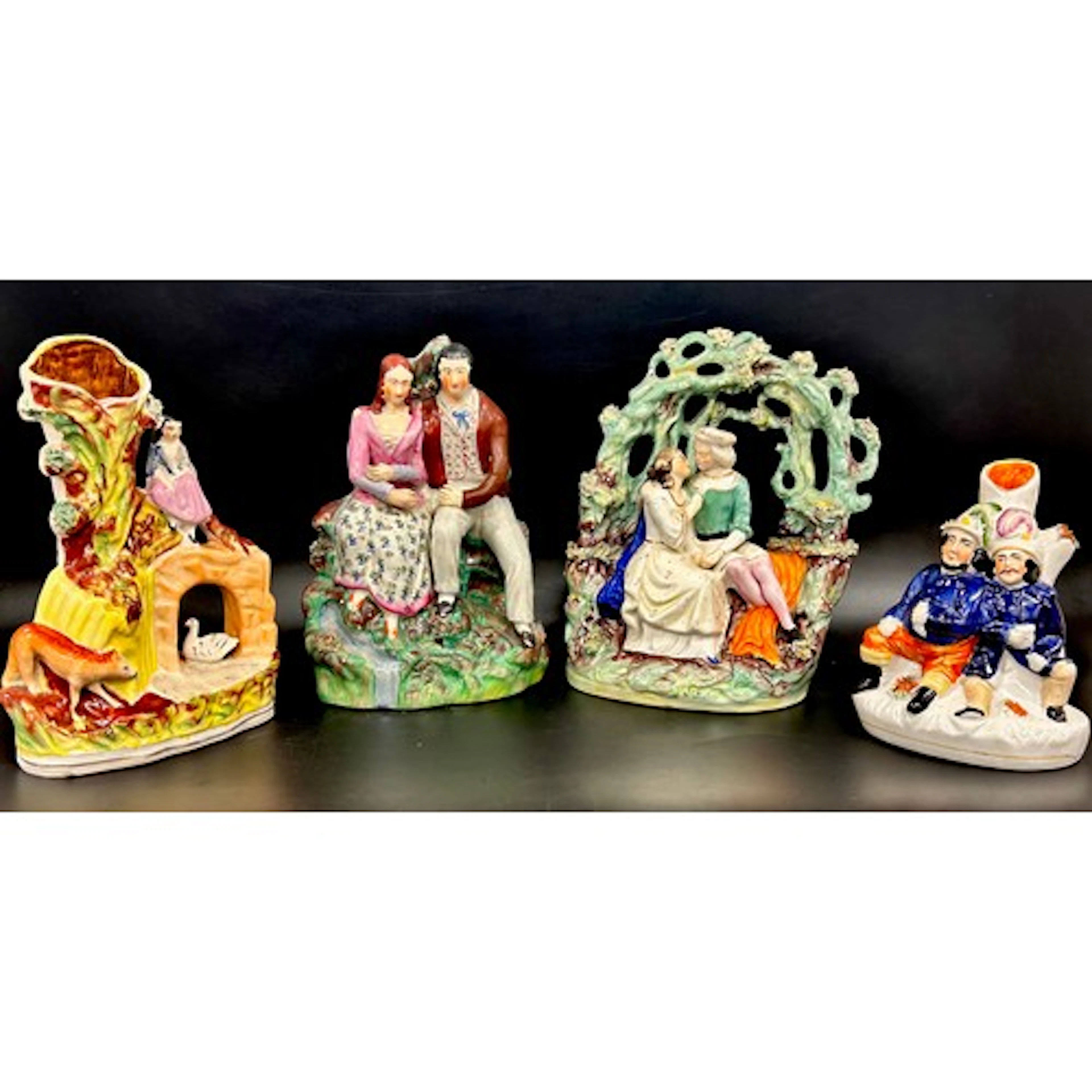 Four Royal Staffordshire flatback figures and spill vases, 2...