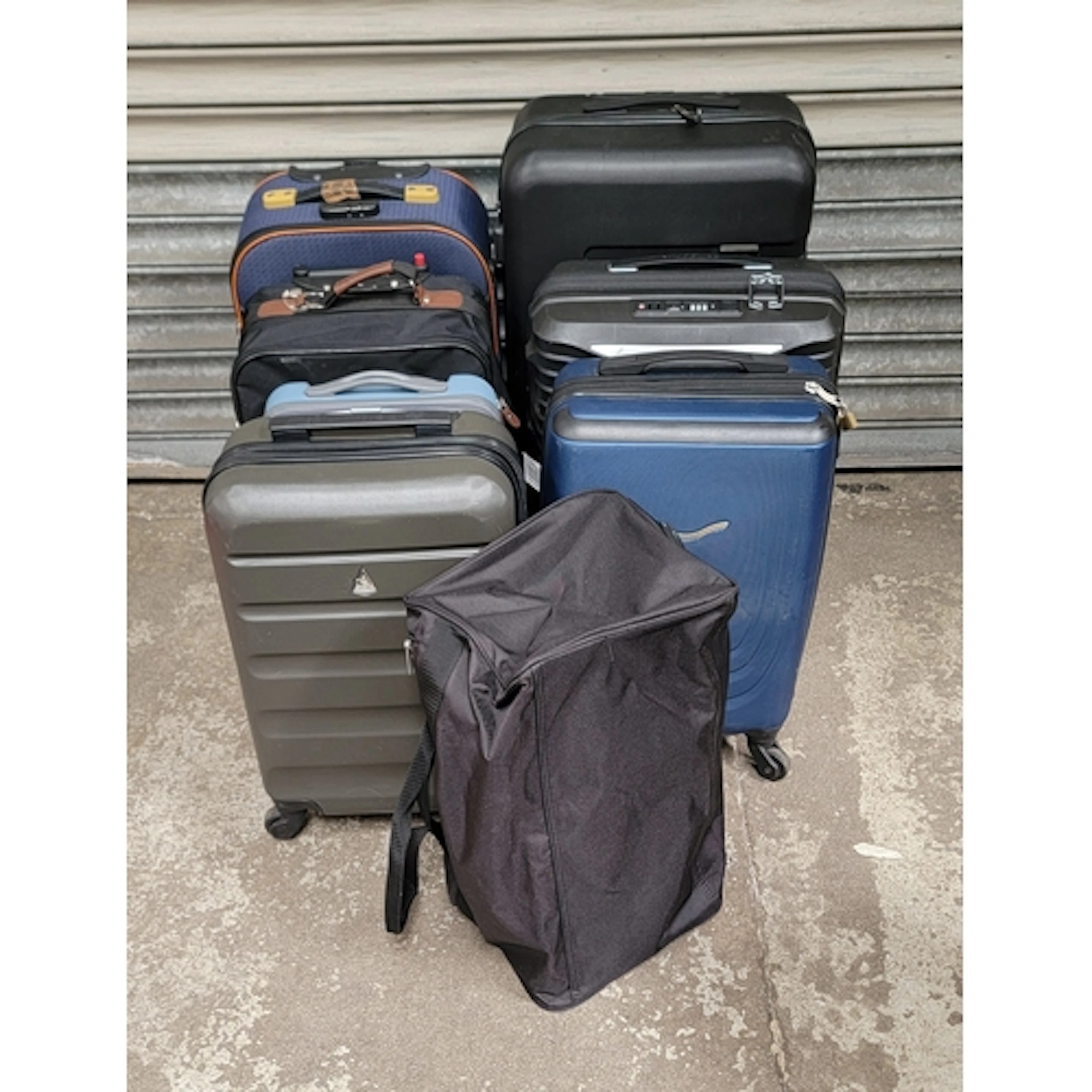 SELECTION OF SEVEN SUITCASES AND ONE HOLDALL including Aero...
