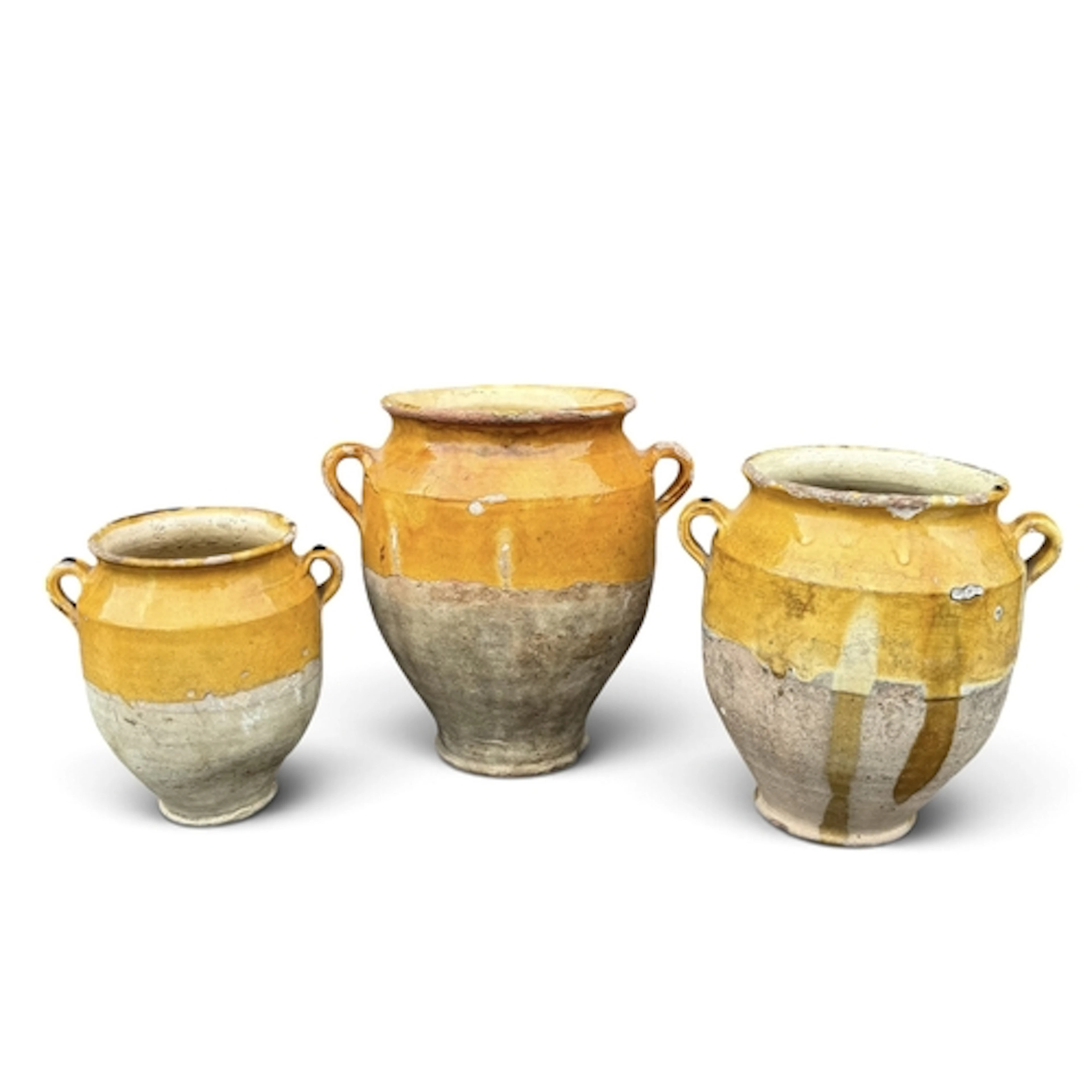 THREE YELLOW GLAZE JARS Each with loop handles....