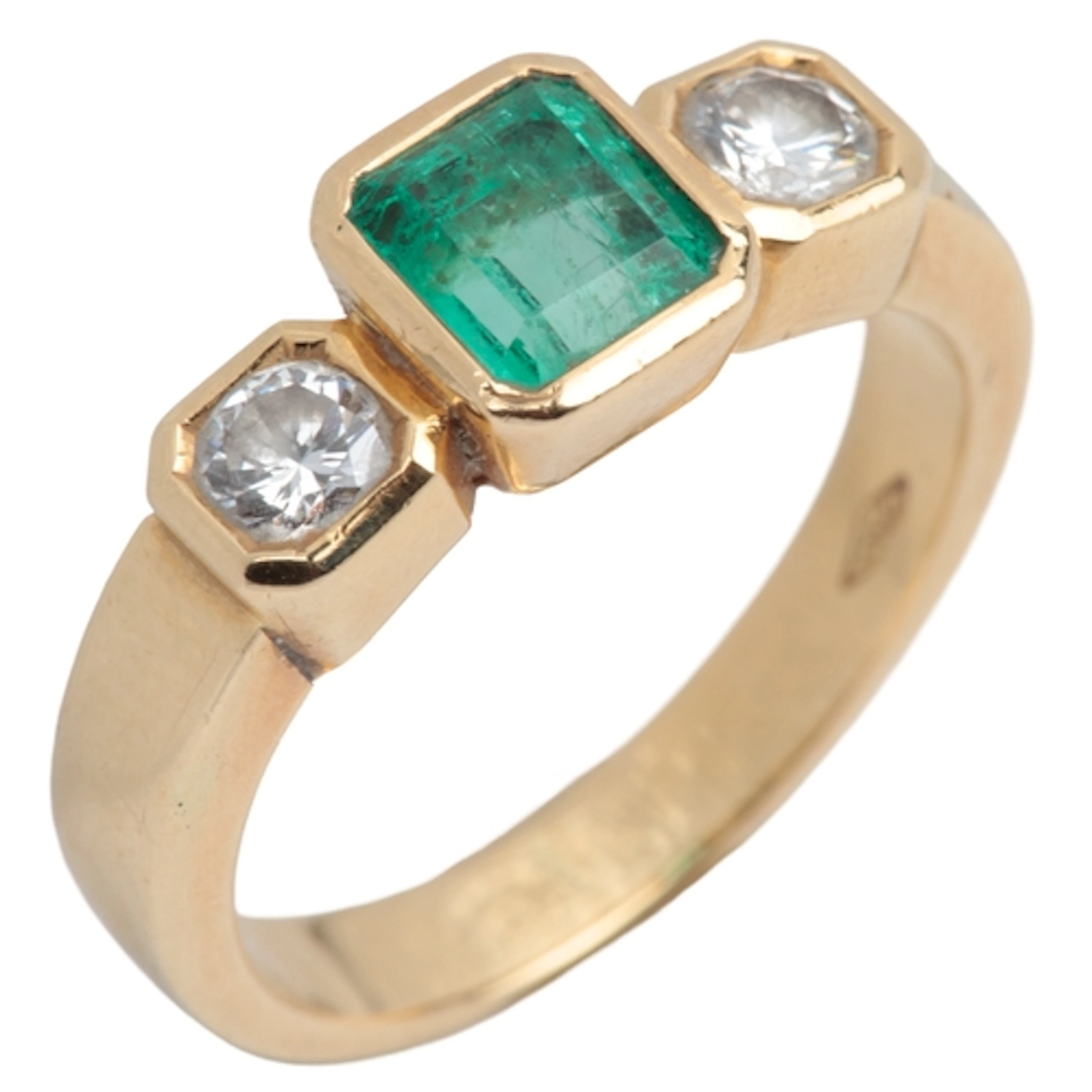 An emerald and diamond ring, collet-set with a step-cut emer...