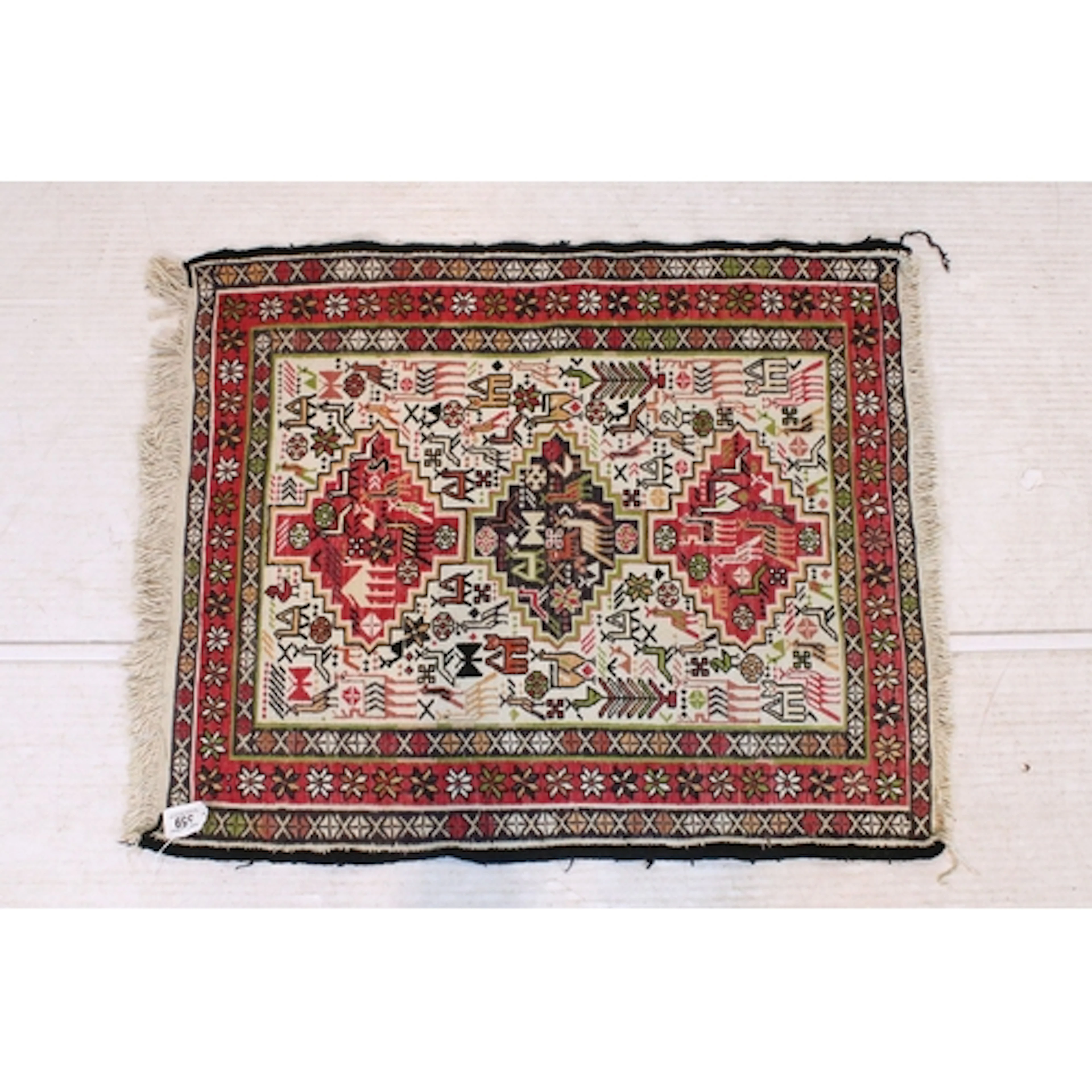 Middle Eastern Soumak cream ground rug of small proportions,...