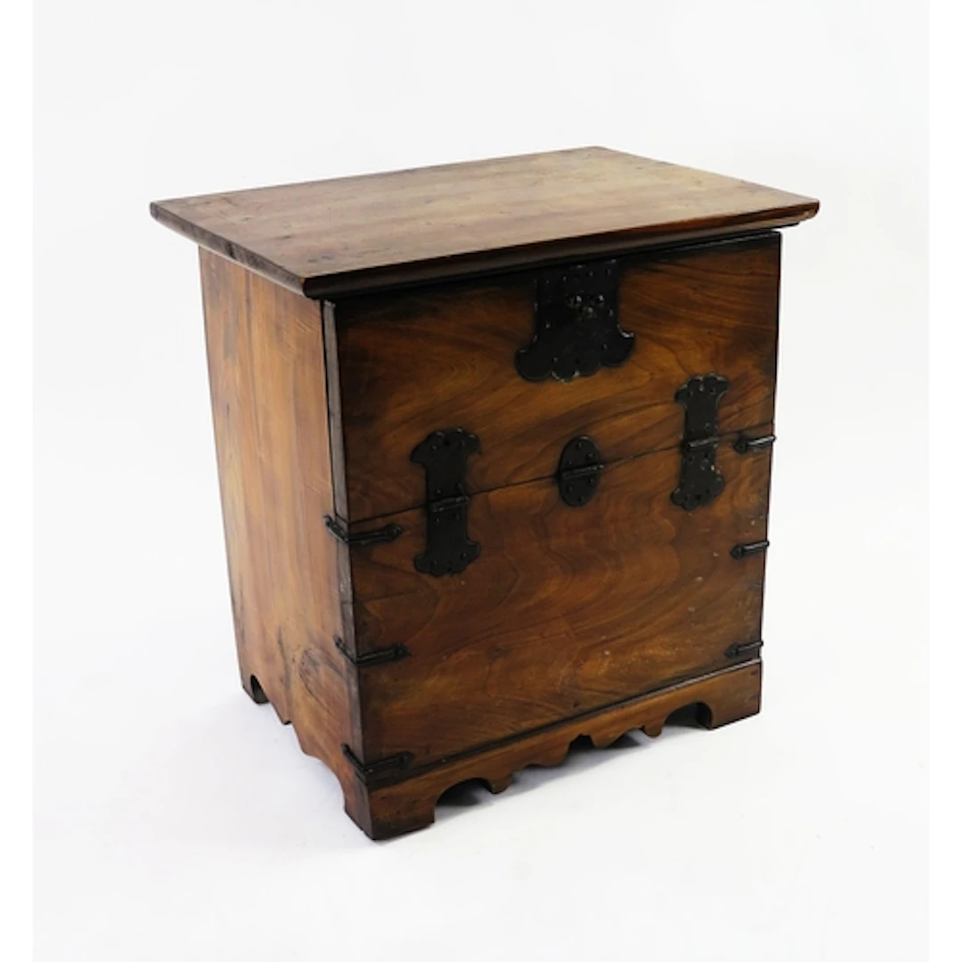 A small walnut cupboard with single fall front flap and meta...
