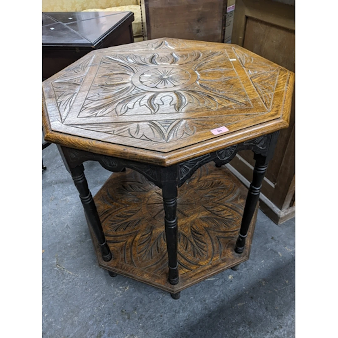 A late Victorian oak two tier occasional table with flower h...