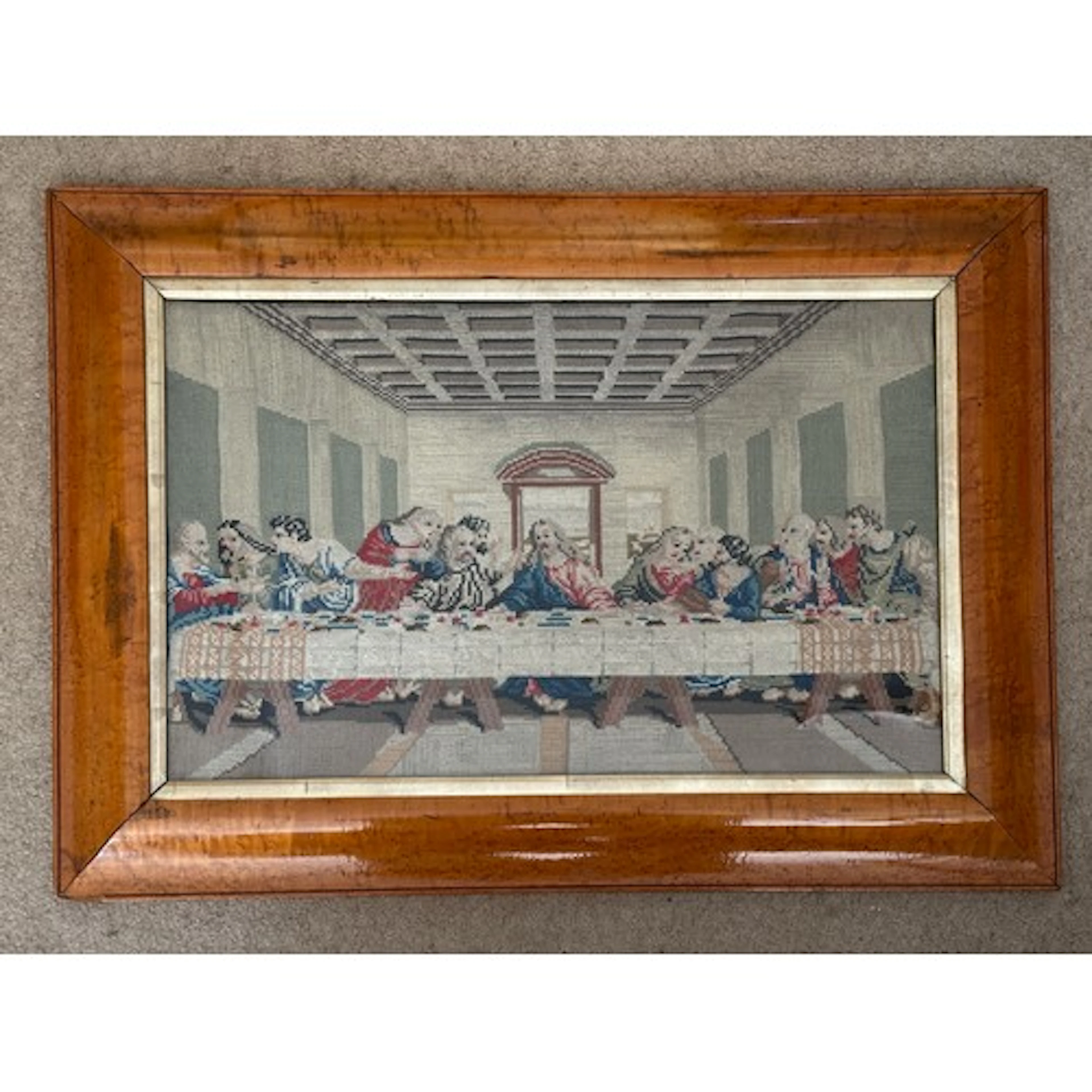 A 19thC wool tapestry depicting The Last Supper in a burr bi...