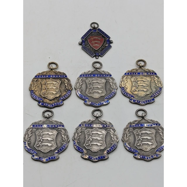 Seven silver and enamel fobs to include Essex County Standar...
