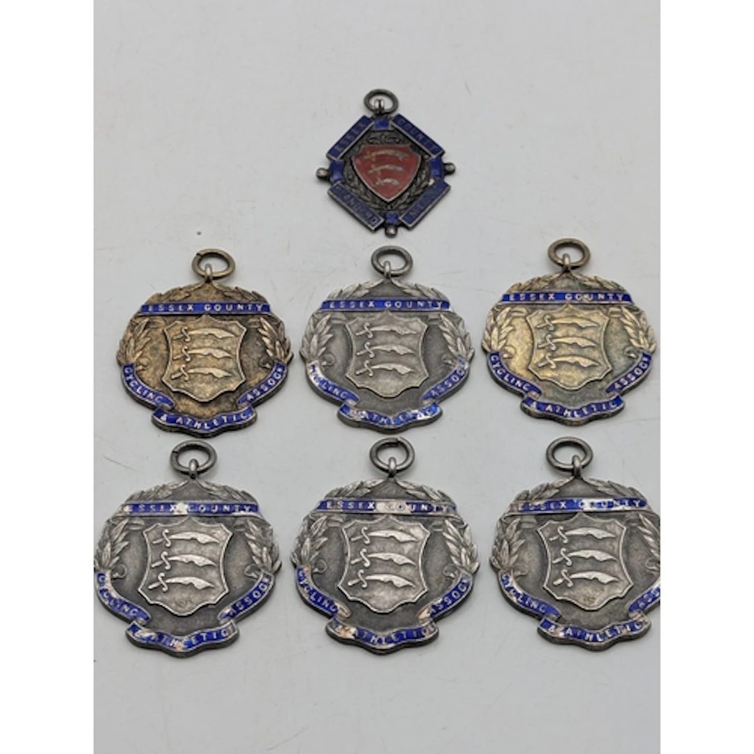 Seven silver and enamel fobs to include Essex County Standar...