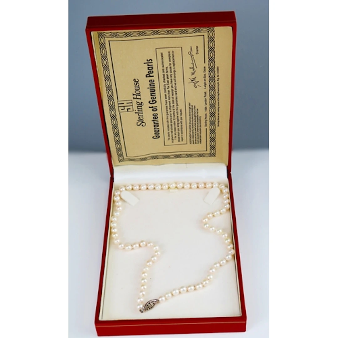 A cultured pearl necklace with silver clasp, 46cm, 19.37g. B...