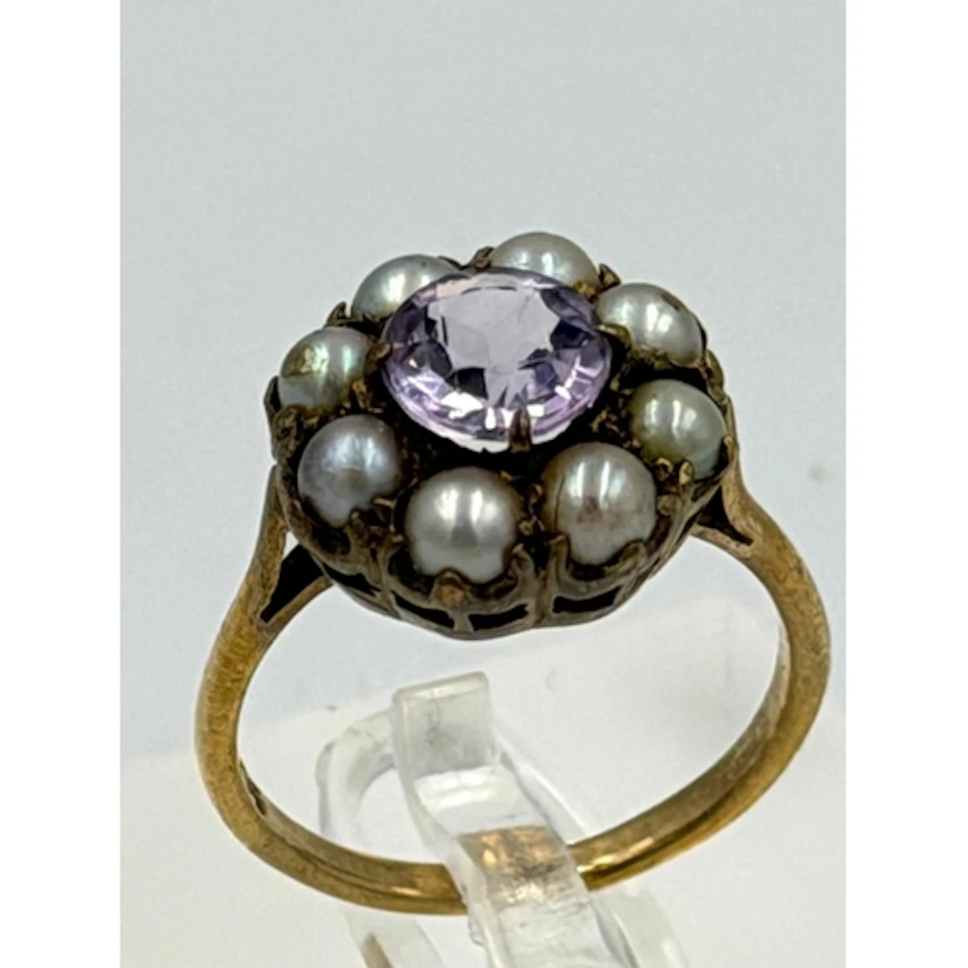 A 9ct yellow gold pearl and amethyst ring, approximate size ...