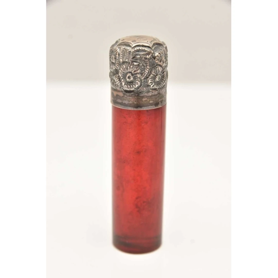 A SILVER MOUNTED SCENT BOTTLE, a cranberry red scent bottle,...