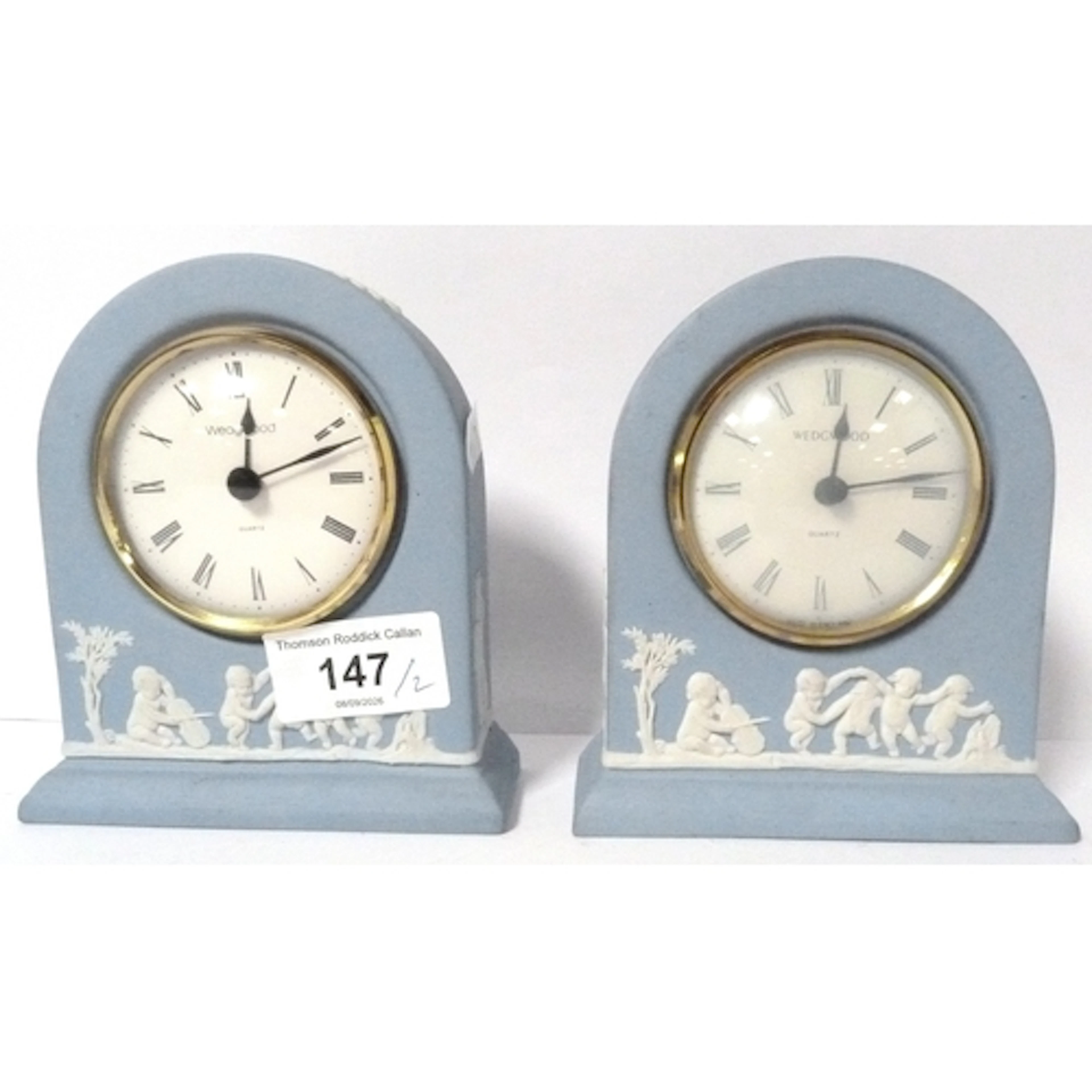 Two Wedgwood jasperware Adams style quartz mantel clocks.