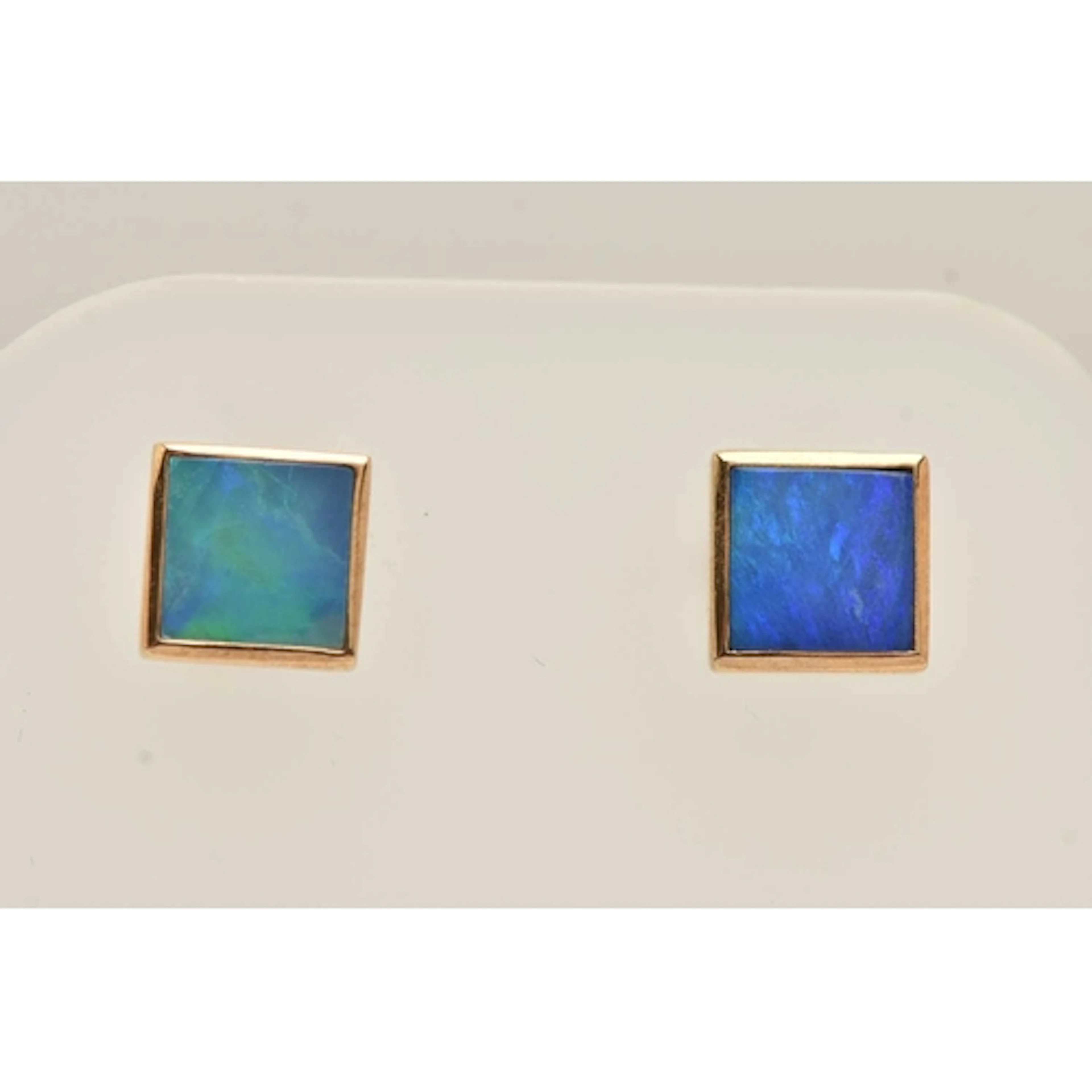 A PAIR OF 9CT GOLD OPAL STUD EARRINGS, each earring of a squ...