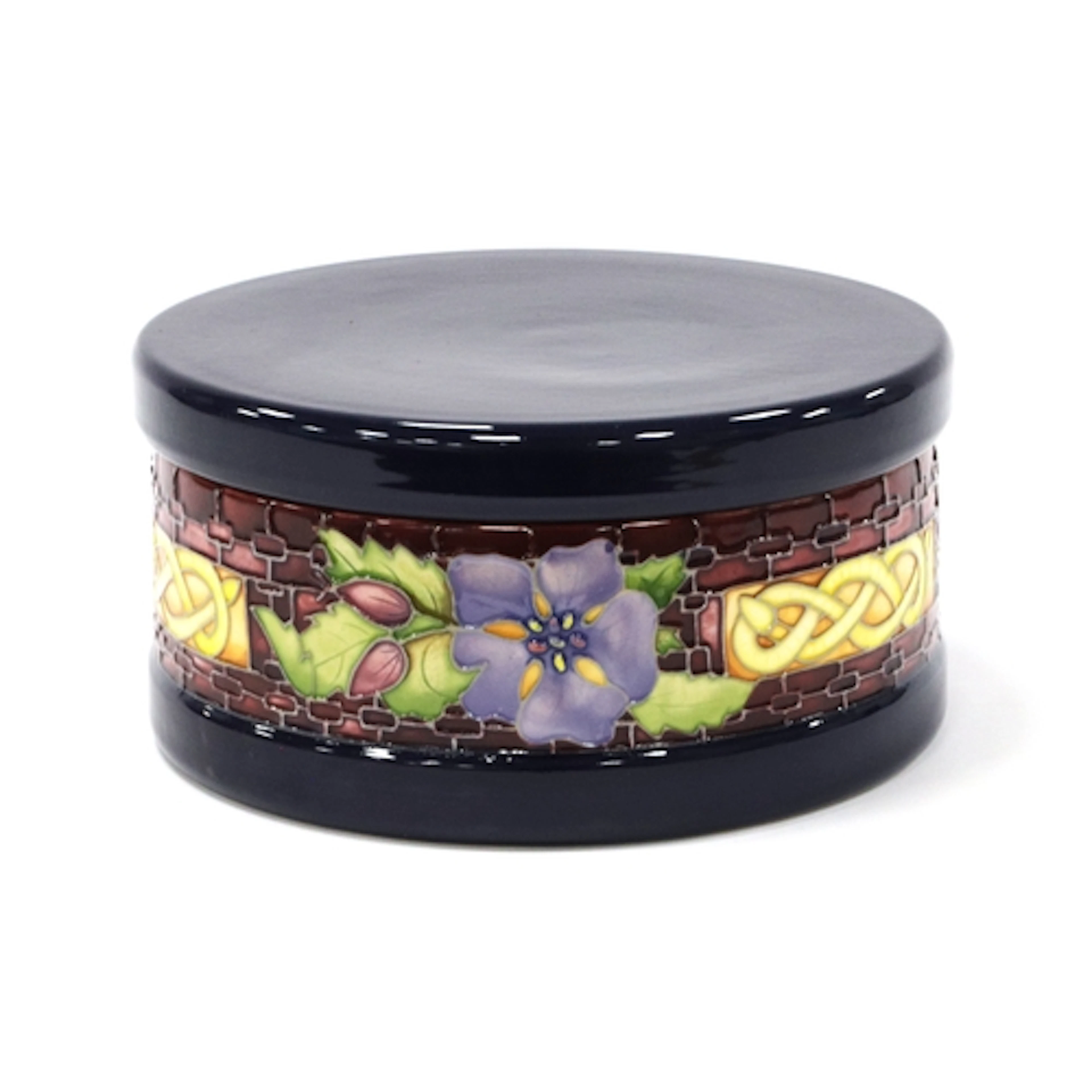 A Moorcroft Pottery Circular Jar and Cover, painted in the '...