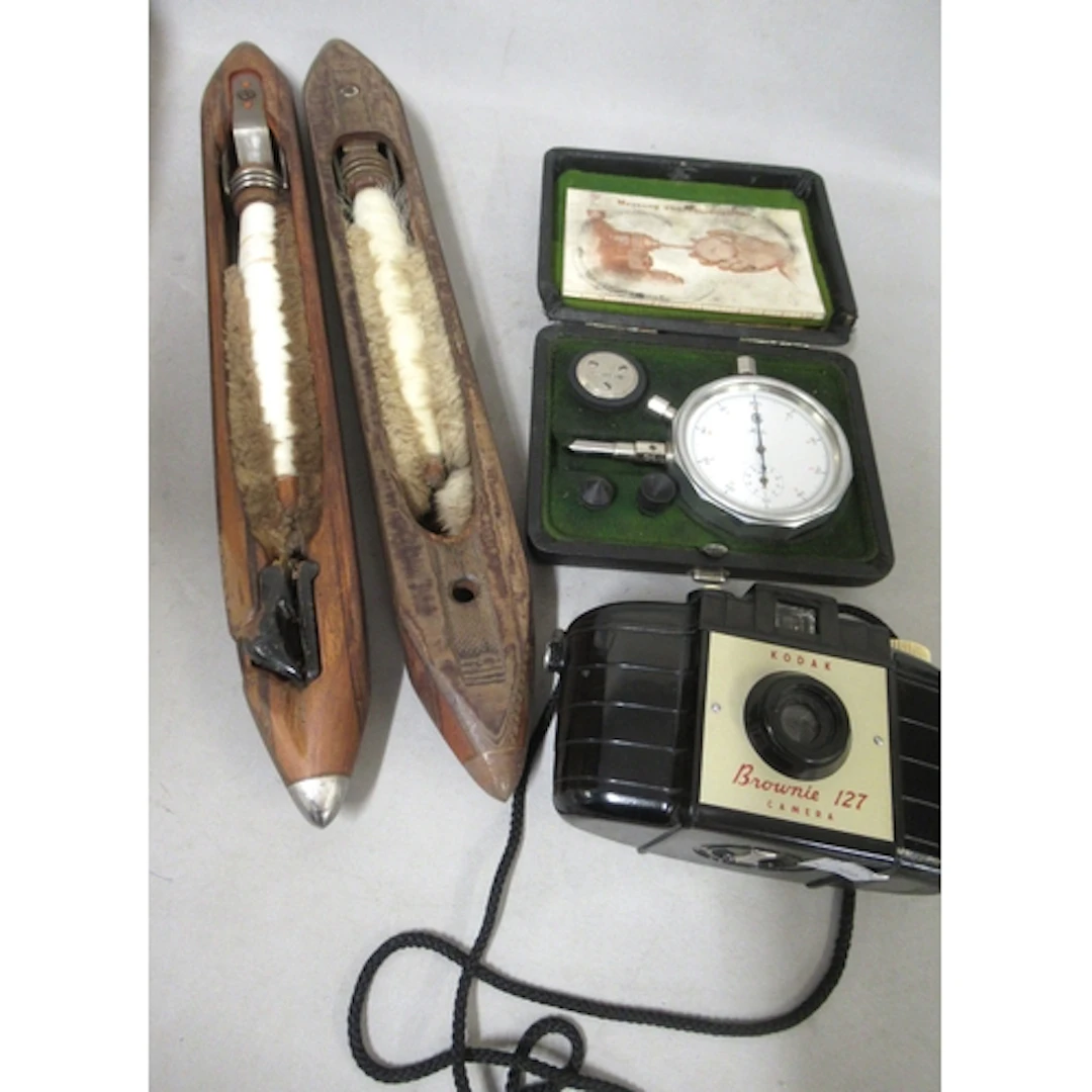Cased German RPM calculator, two antique shuttle bobbins and...