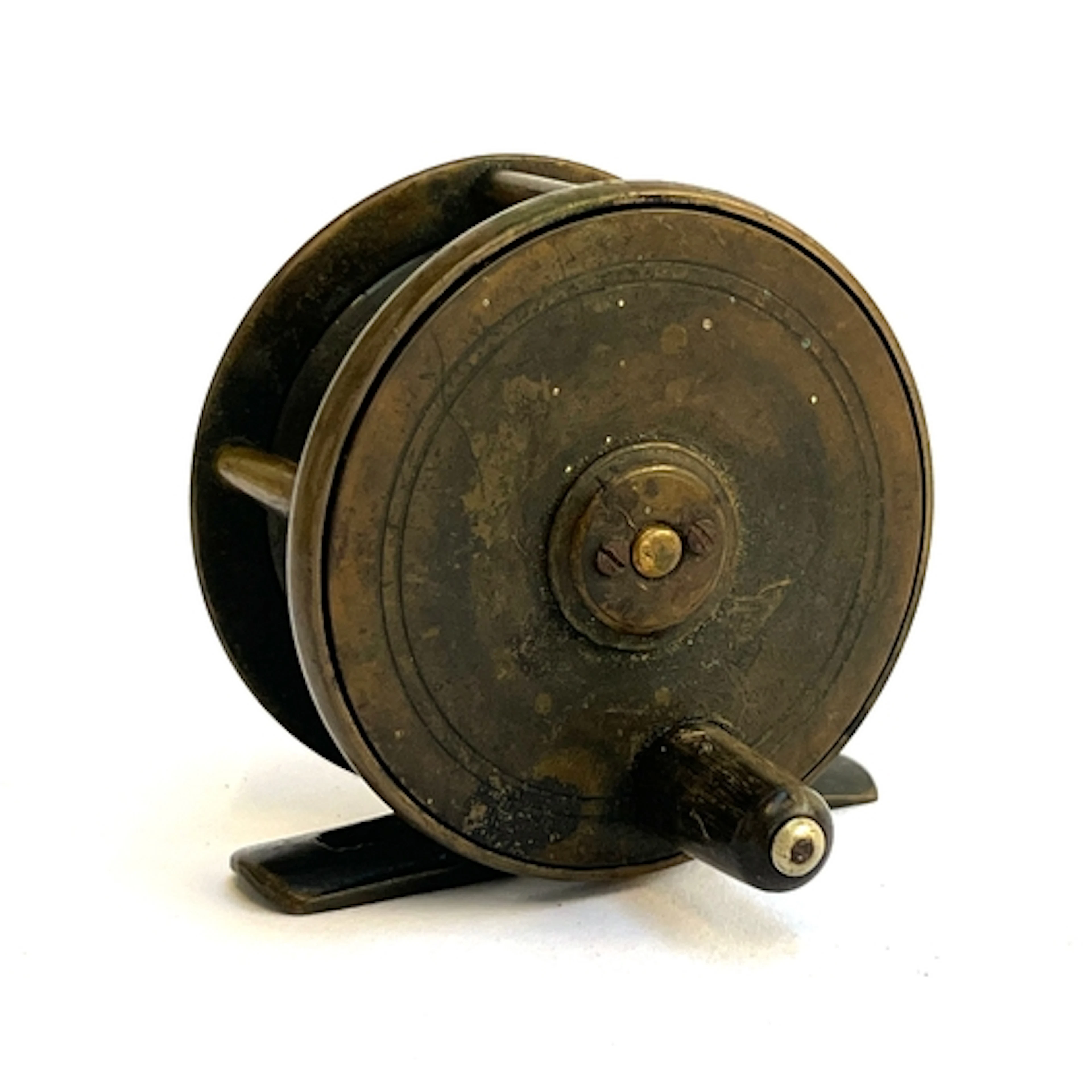 An antique brass 2.5" centre pin reel