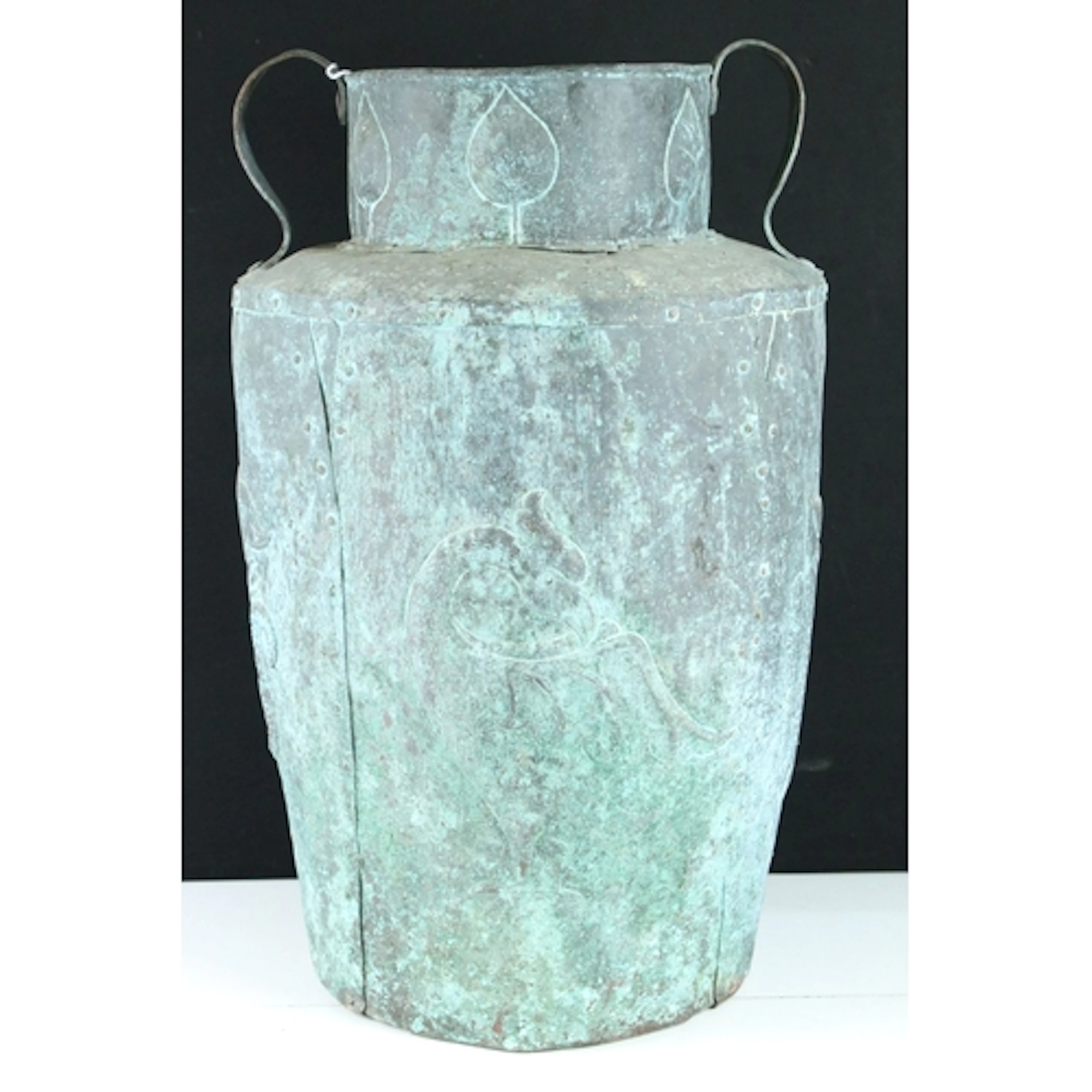 Arts and Crafts repousse copper twin-handled pot, in the man...