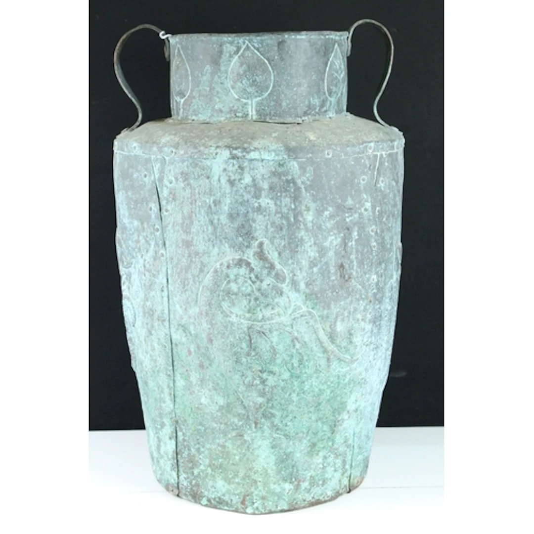 Arts and Crafts repousse copper twin-handled pot, in the man...