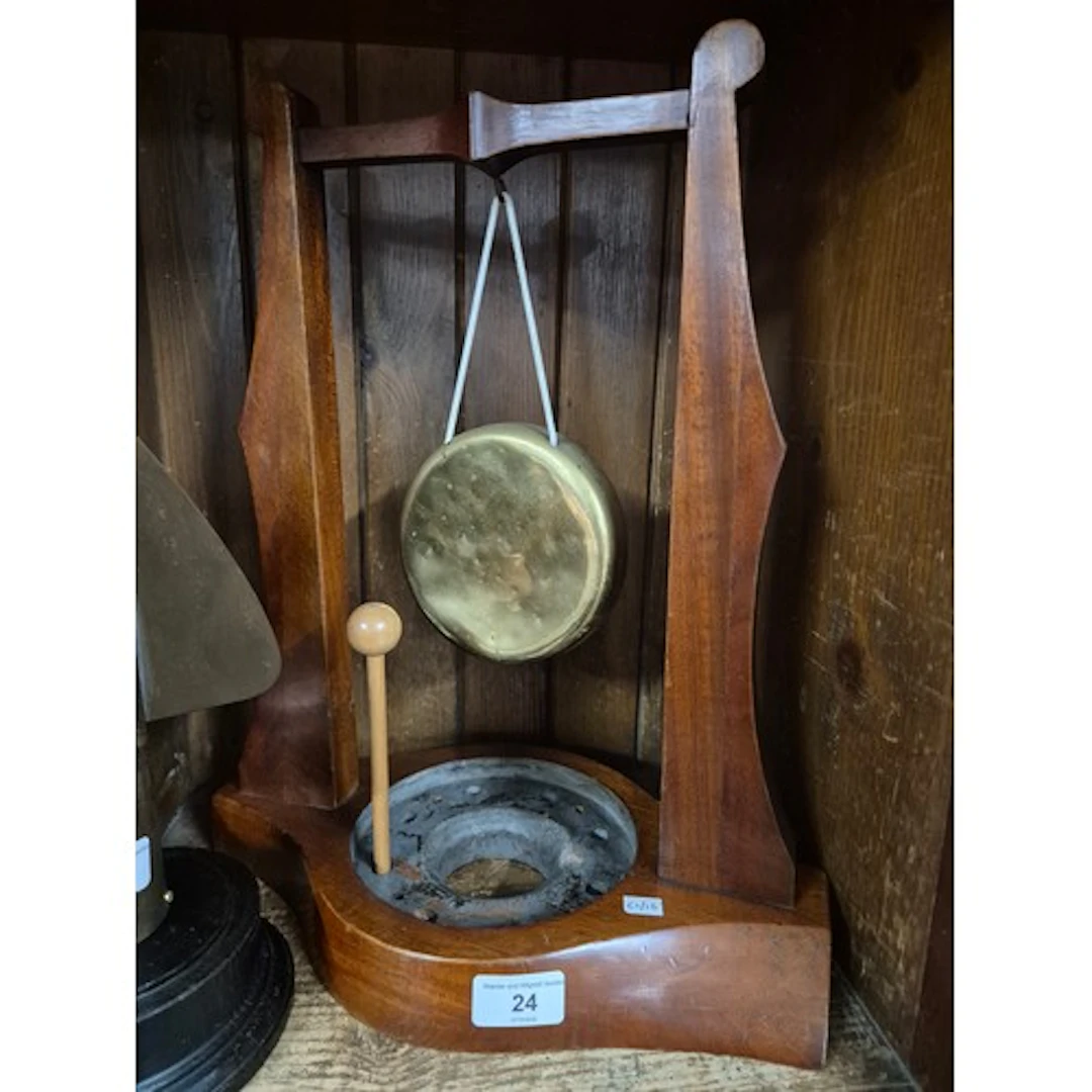 A mahogany table gong made from an old aircraft propellor.