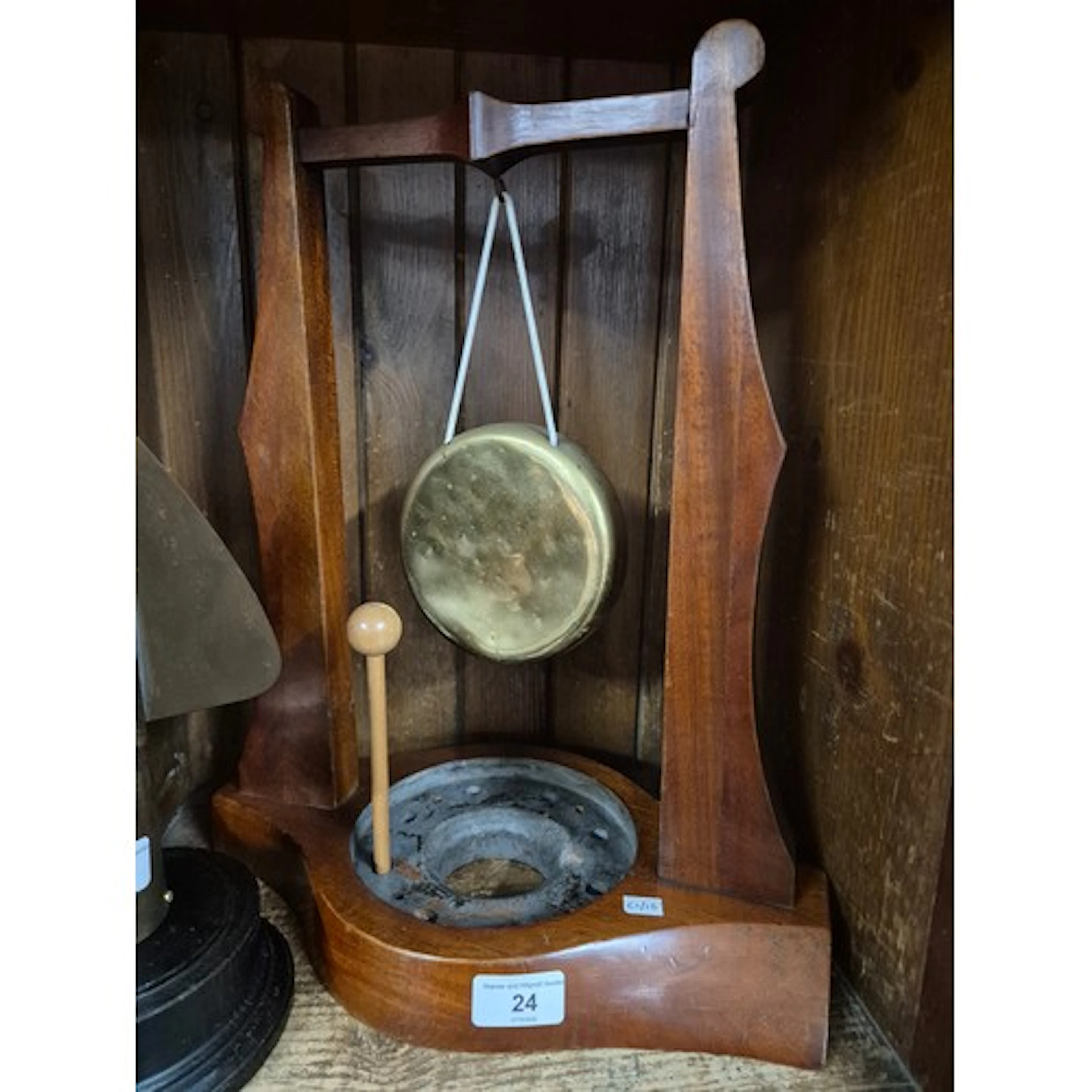 A mahogany table gong made from an old aircraft propellor.