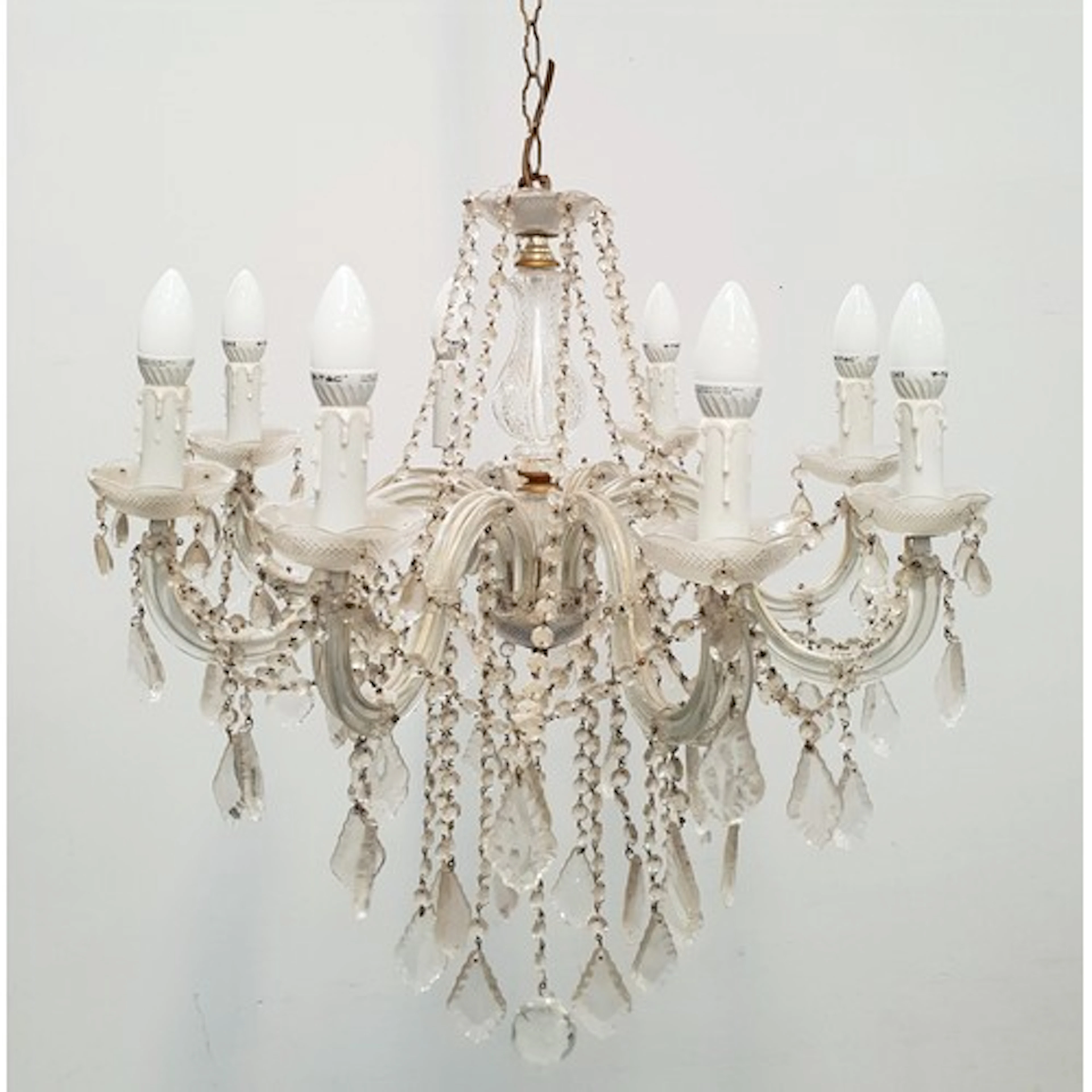 PLASTIC AND GLASS FAUX CANDLESTICK CHANDELIER the eight cur...
