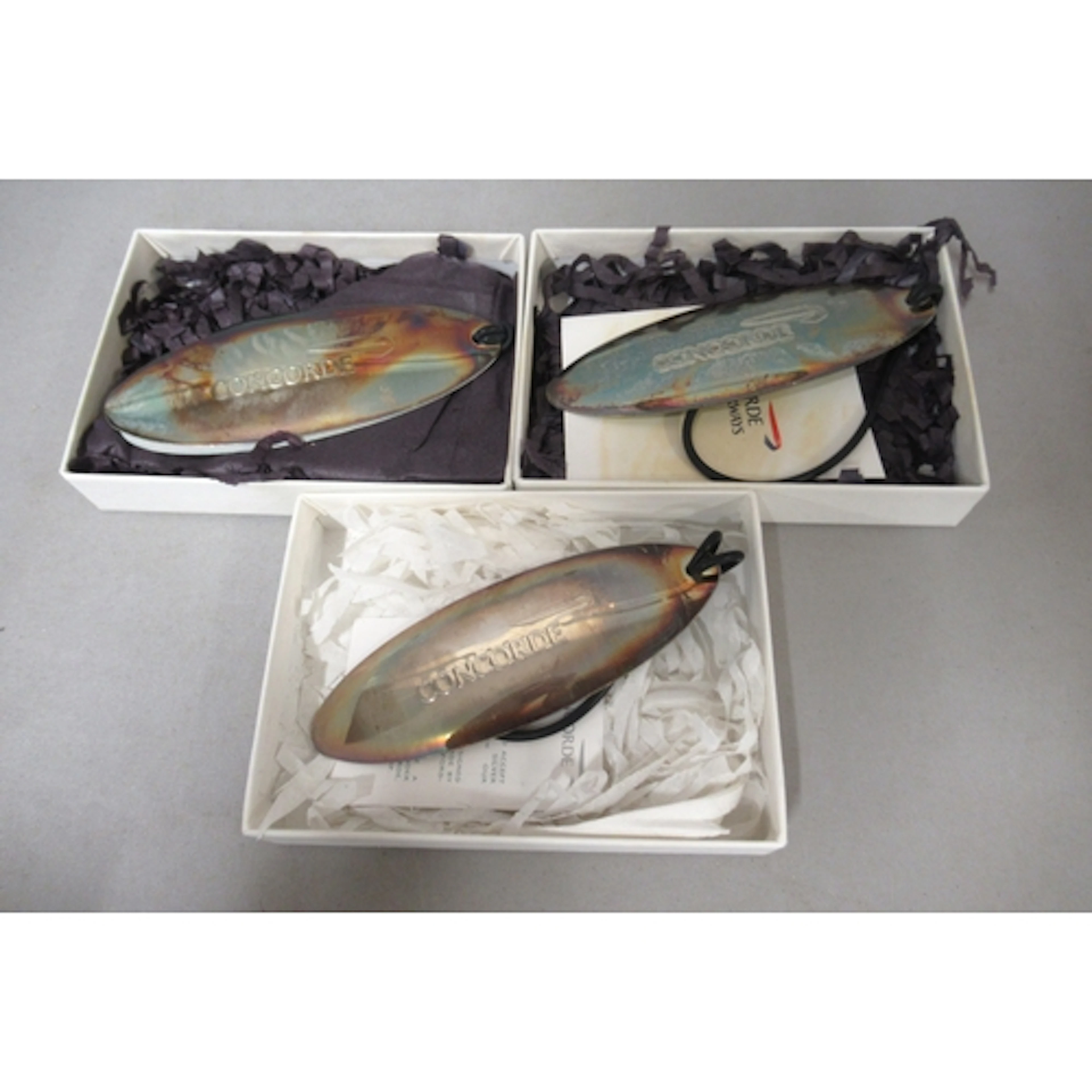 Group of three Concorde souvenir silver luggage tags in orig...