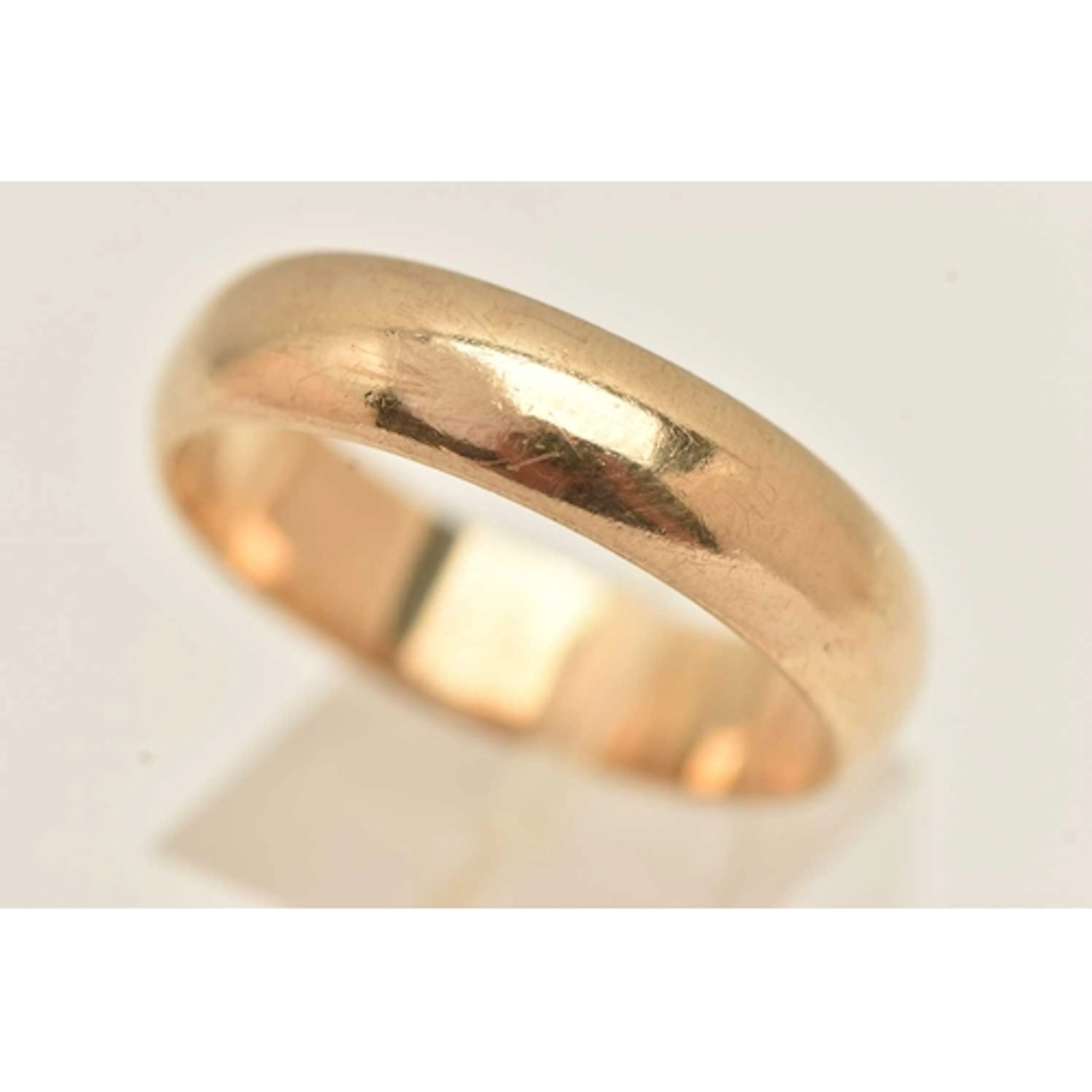 A HEAVY 9CT GOLD BAND RING, approximate band width 6.2mm, ha...