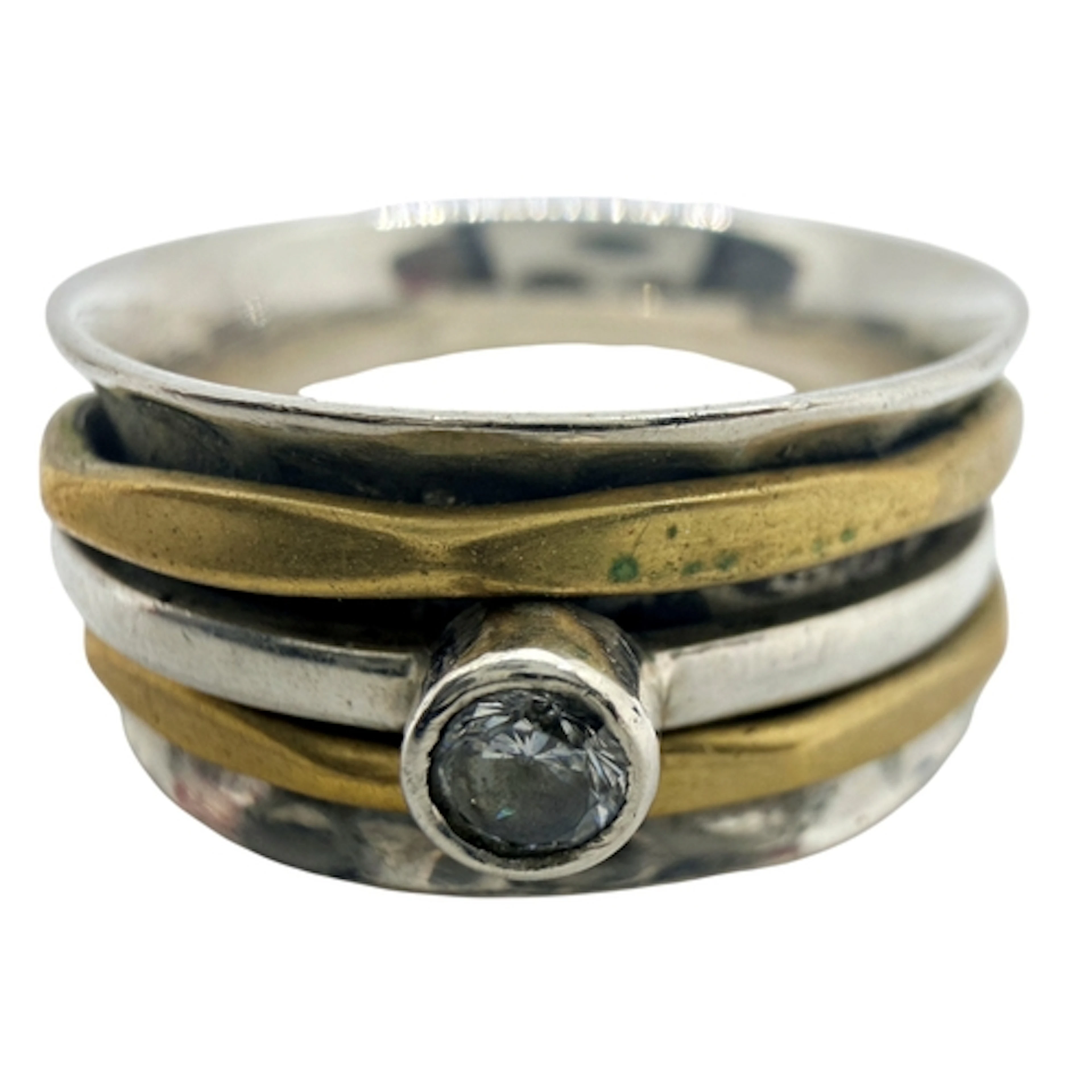 A modernist two tone spinner ring, set with a cubic zirconia...