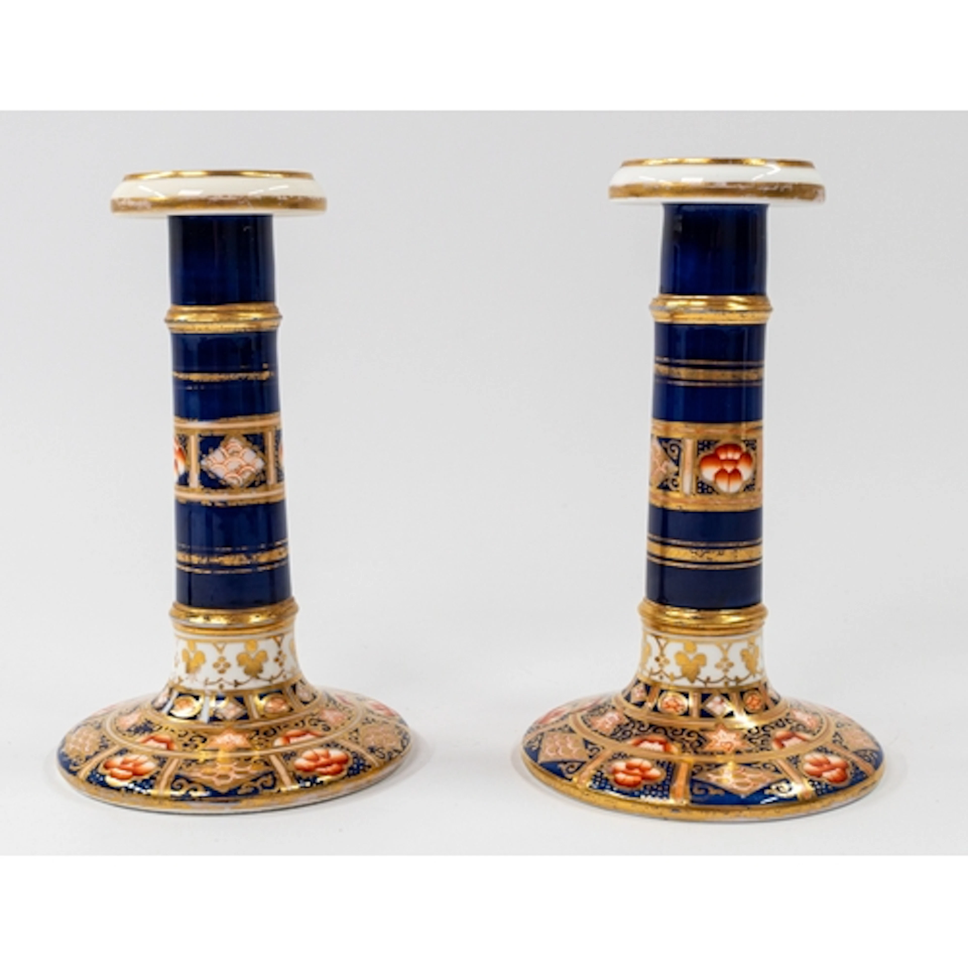 Ceramics: A pair of English porcelain Imari candlesticks, 1s...