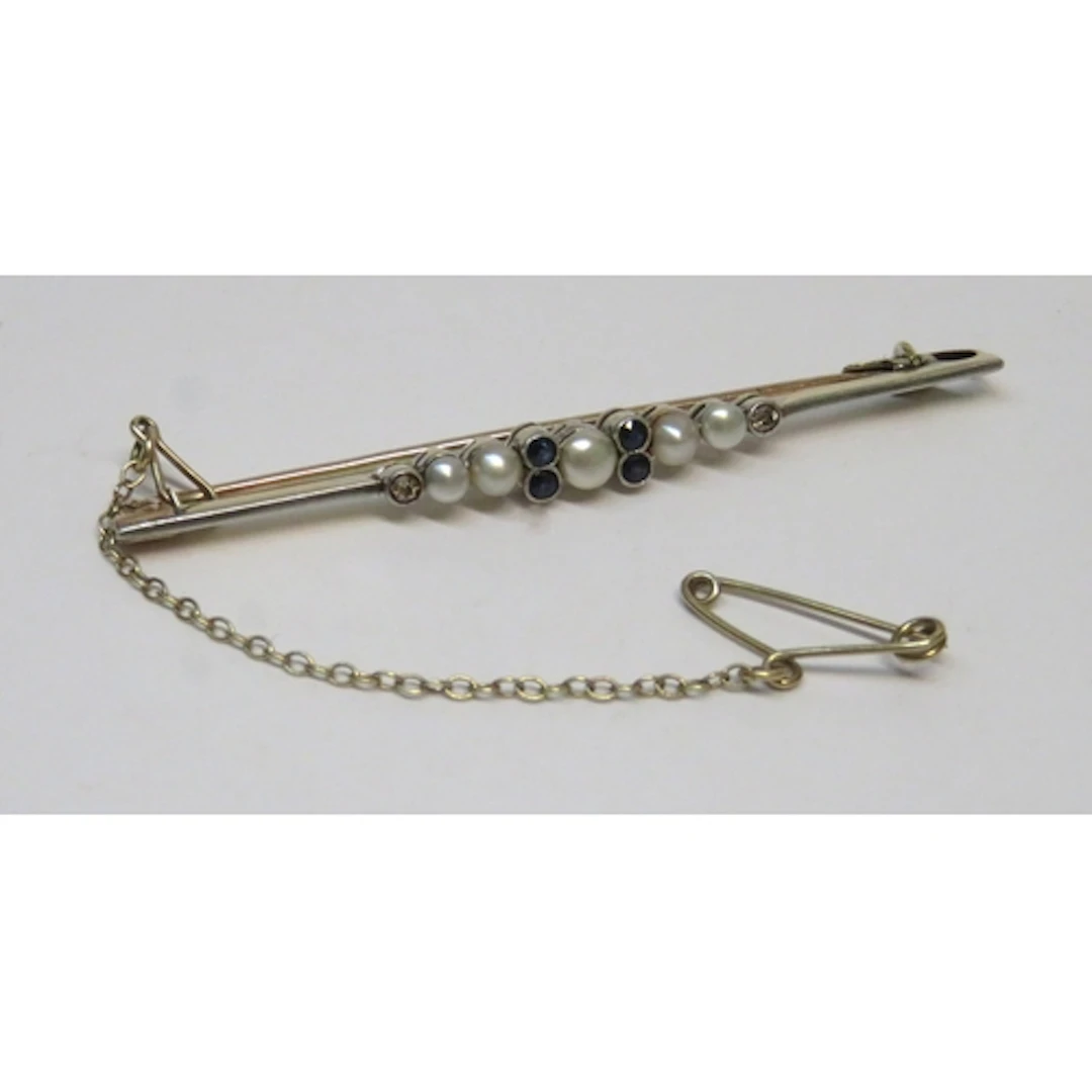 Art Deco white and yellow metal sapphire, split pearl and di...