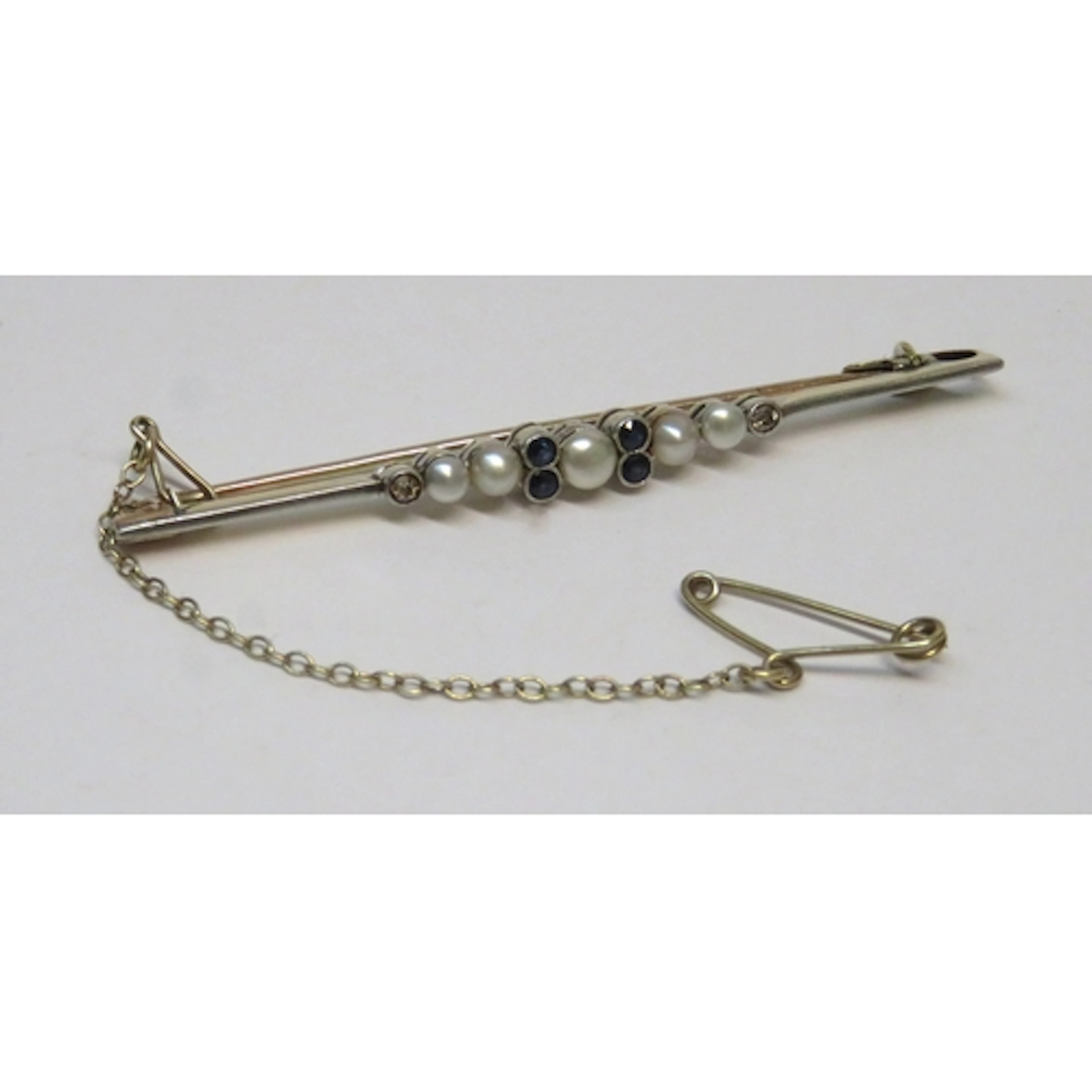 Art Deco white and yellow metal sapphire, split pearl and di...