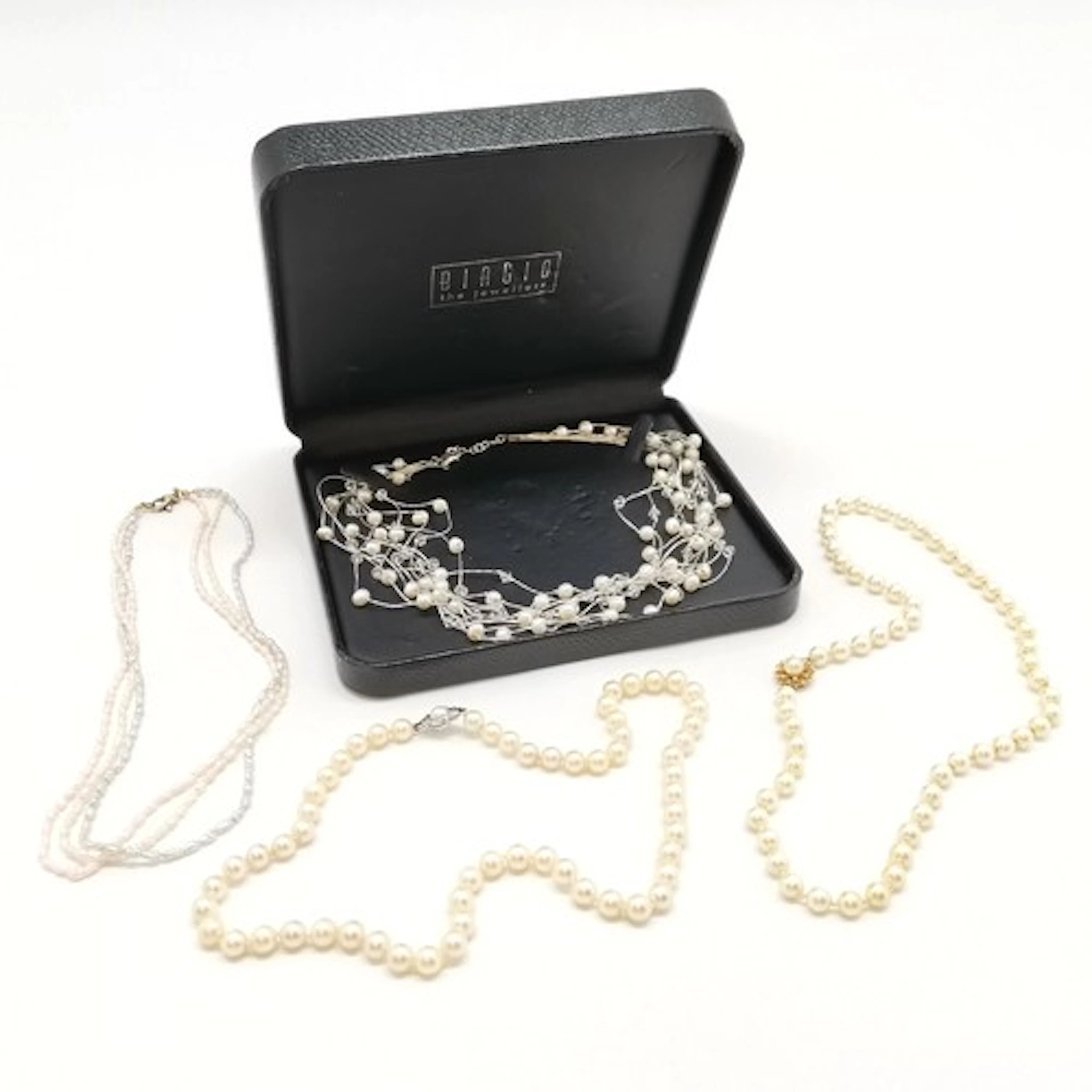 4 x Silver clasped strands of pearls inc JKa with floral cla...
