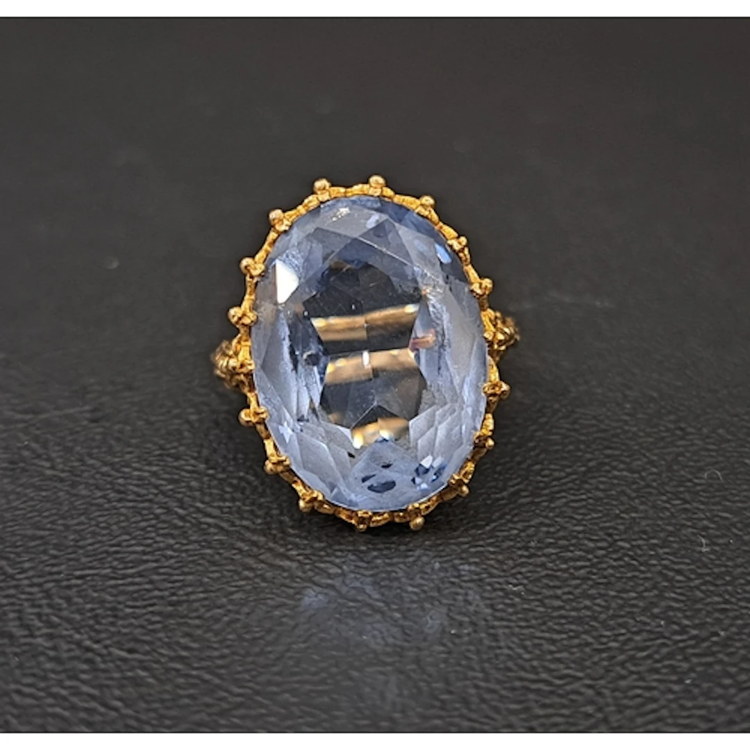 IMPRESSIVE BLUE TOPAZ SINGLE STONE DRESS RING the oval cut t...
