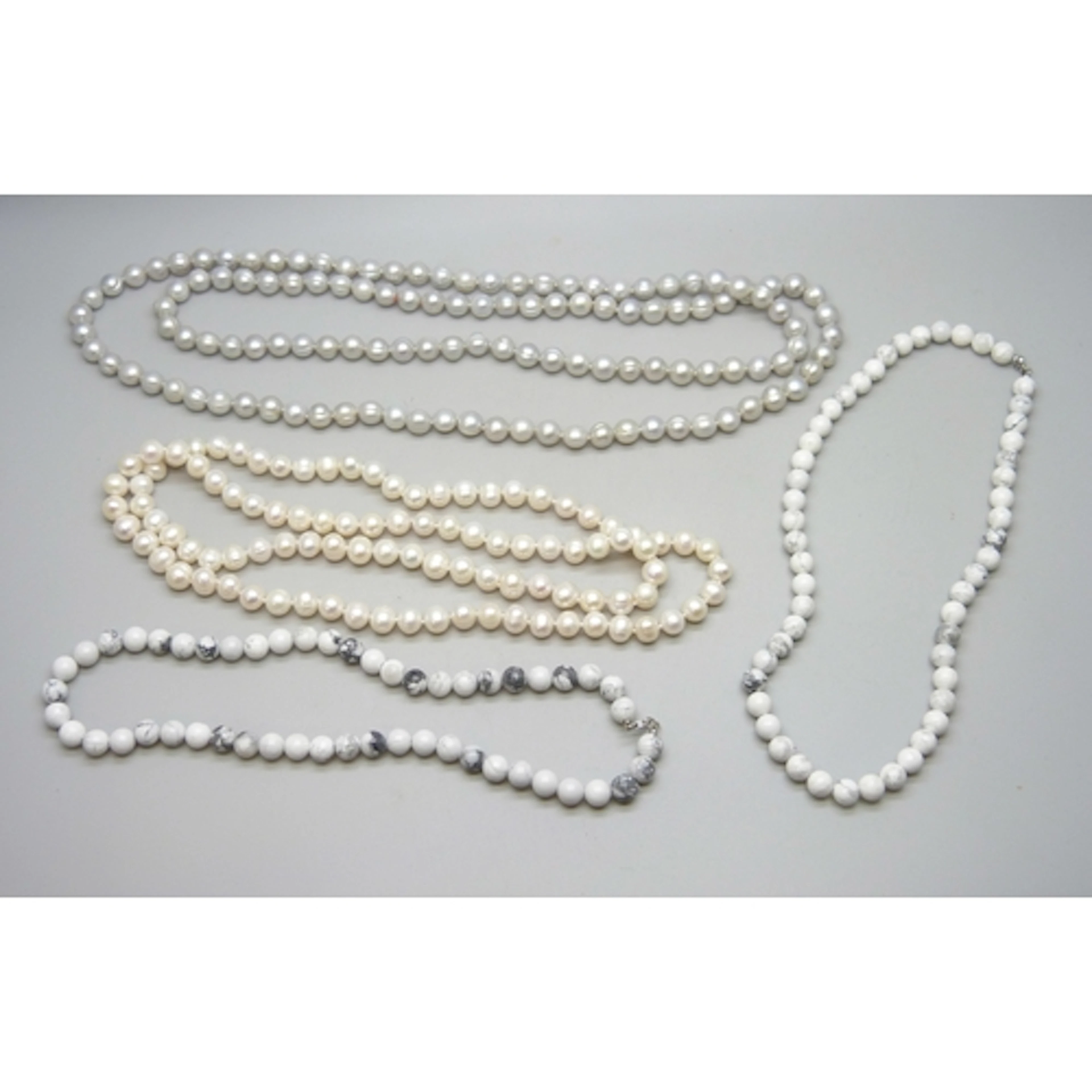 Two opera length pearl necklaces, 104g and 133g, and two how...