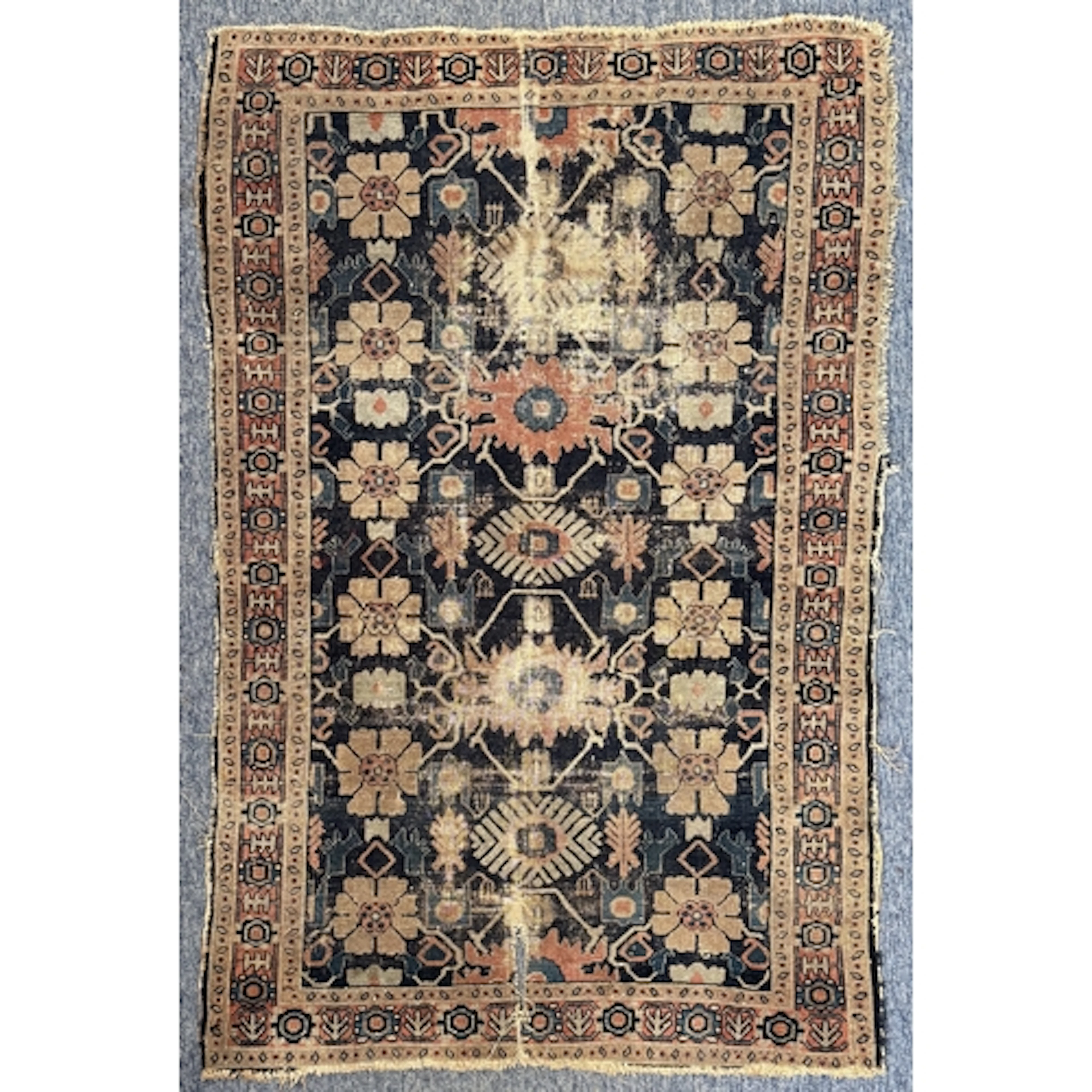 An early twentieth century Persian village rug - hand knotte...