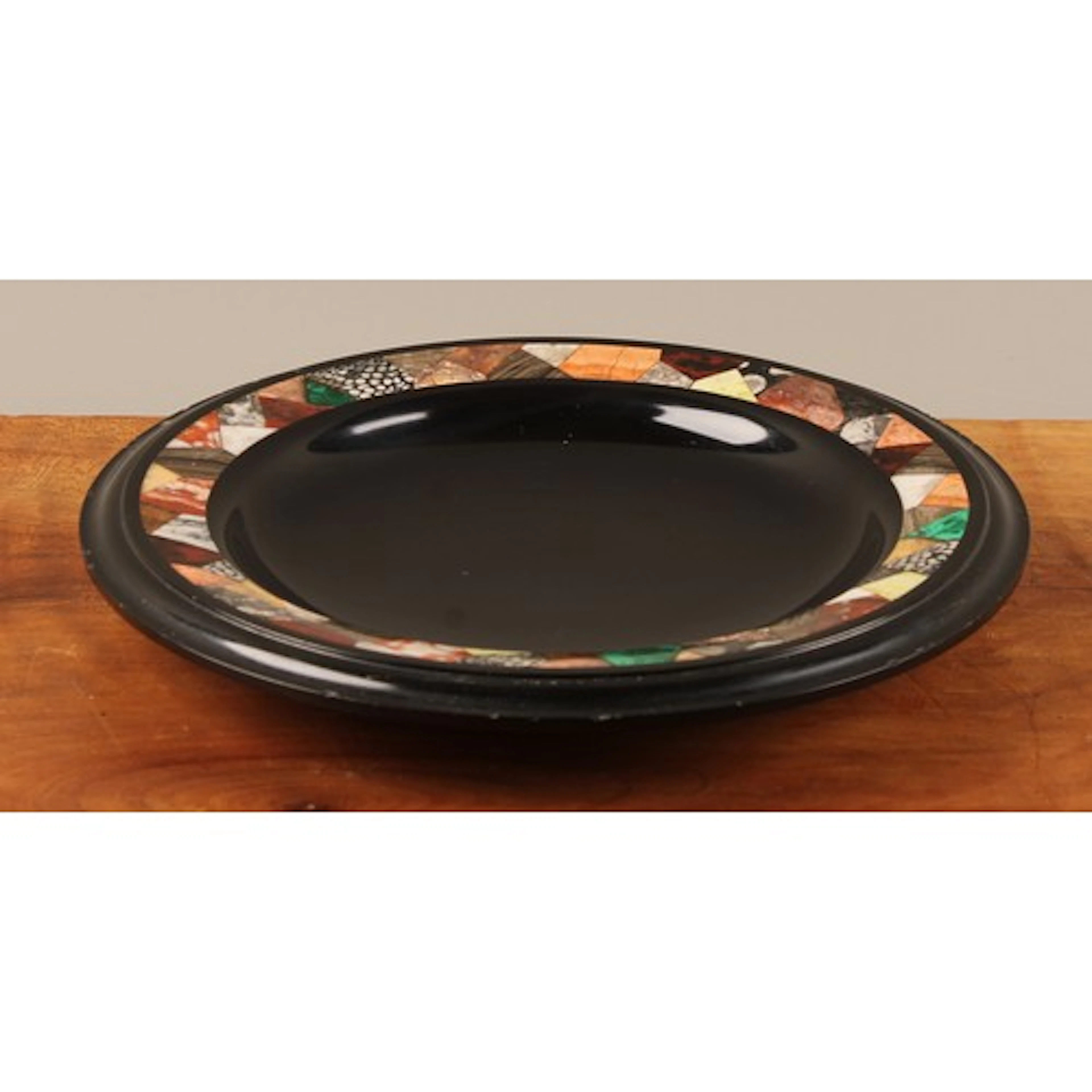 A 19th century Ashford black marble shallow dish, the broad ...