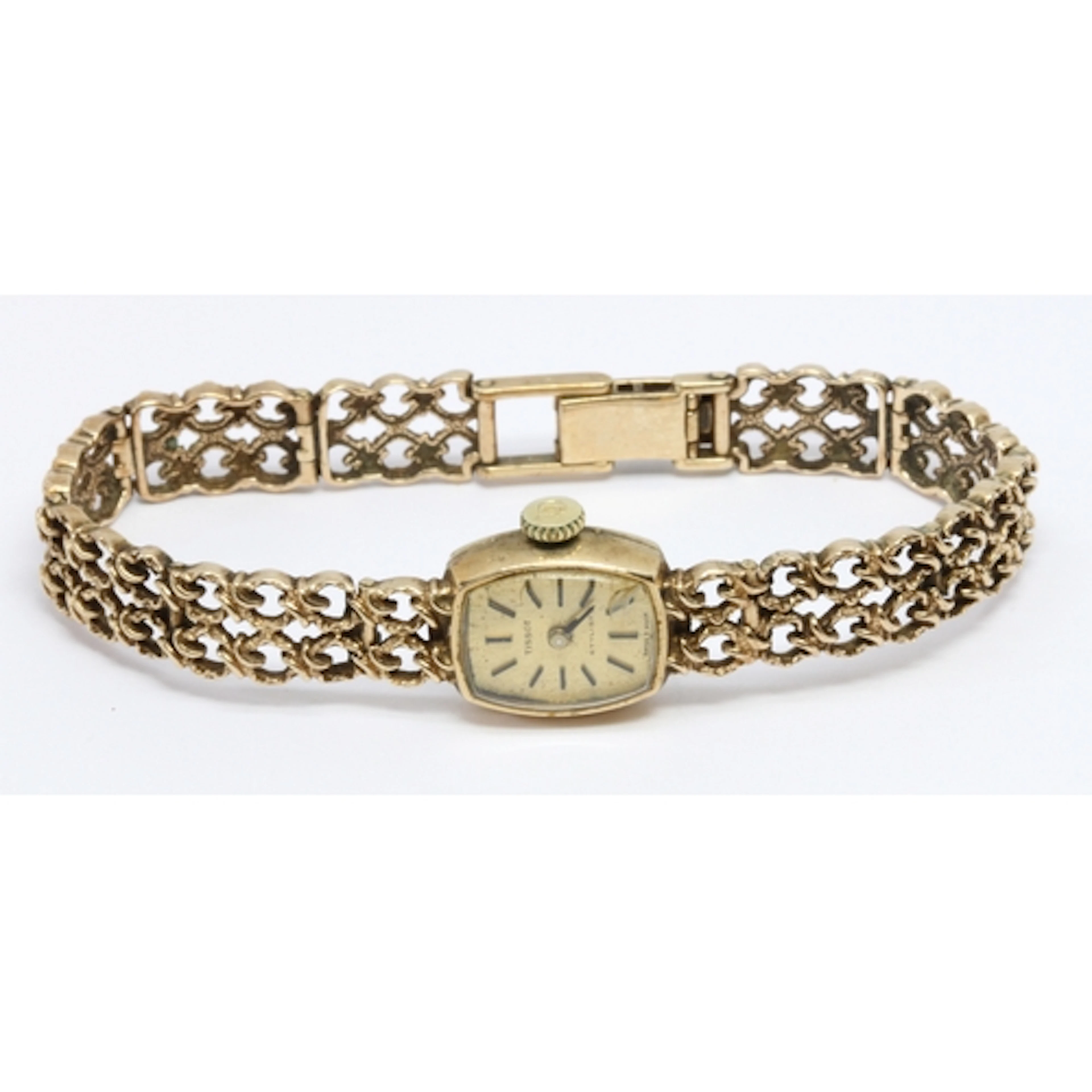 A ladies 9ct gold Tissot wristwatch with integrated 9ct gold...